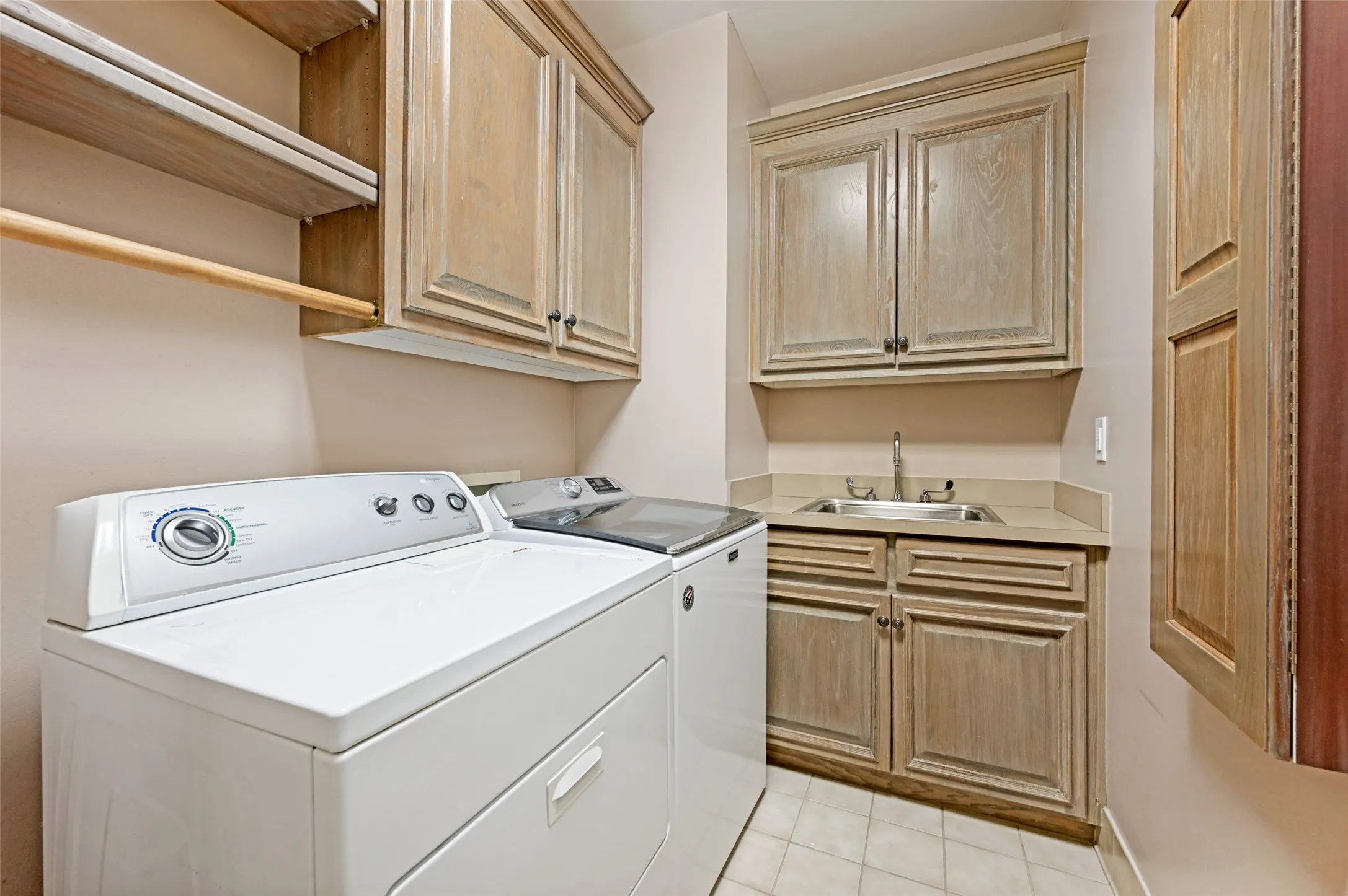 View of laundry room (washer and dryer can remain with accpted offer,