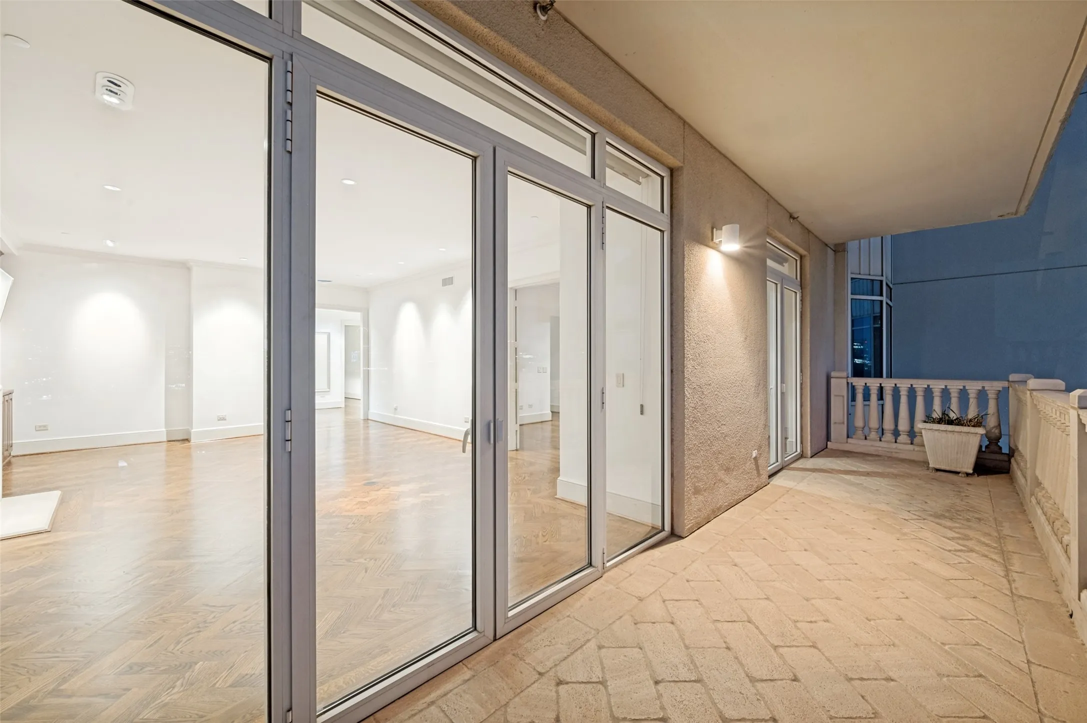 Balcony shared by living room and secondary bedroom facing east to Downtown Dallas