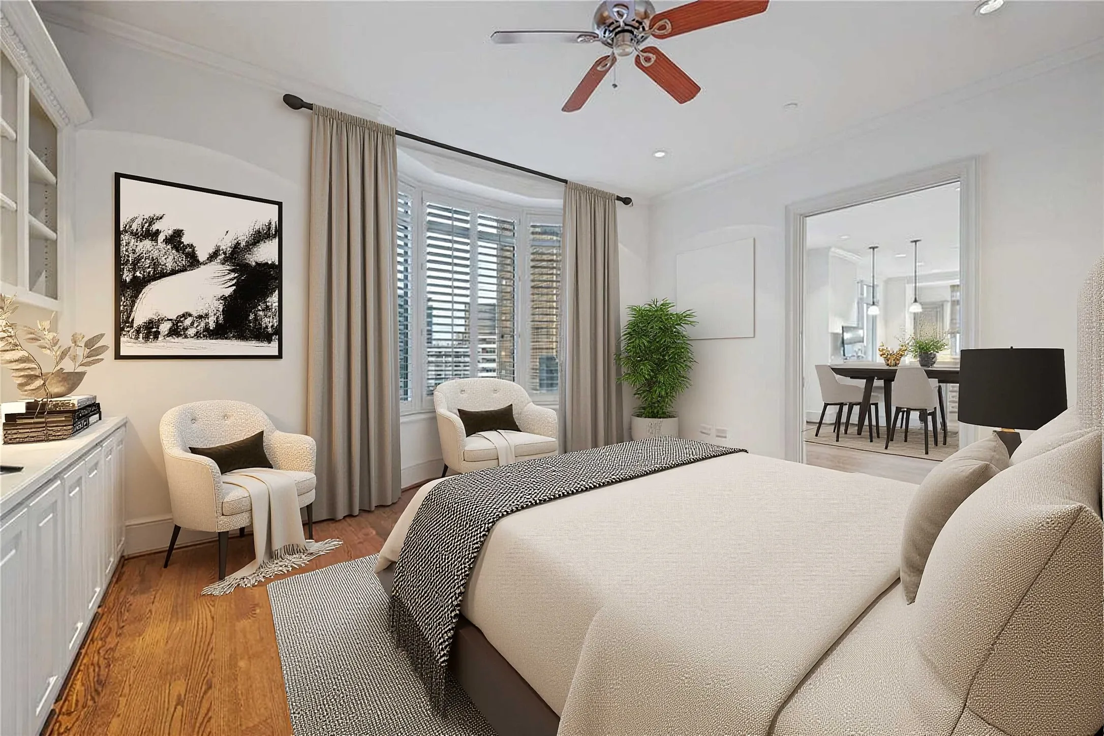 View of third bedroom with built-ins and French doors opening to the dining area (virtually staged)