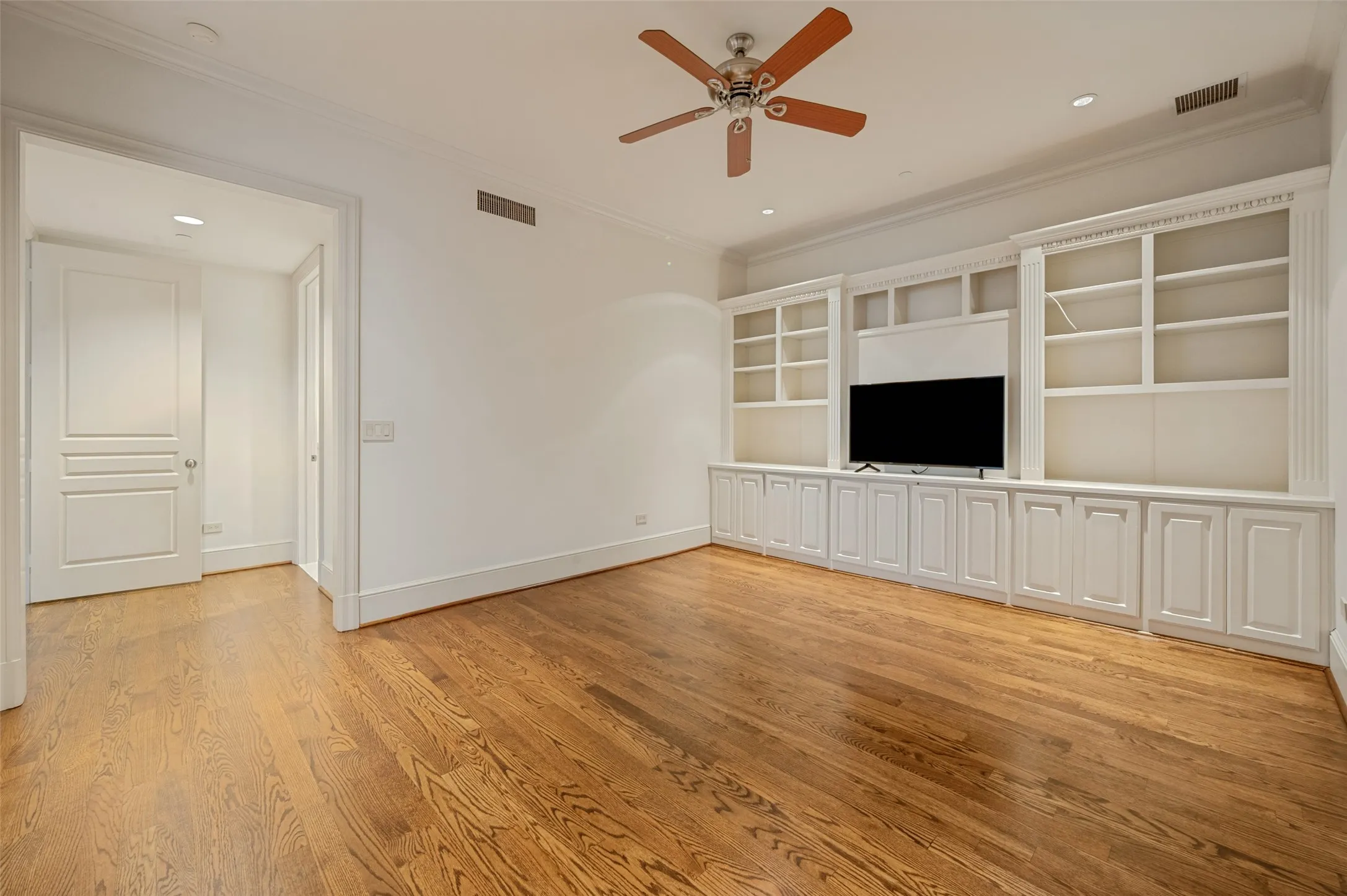 View of third bedroom into hallway containing walk-in closet and bath. Could be an office or den if third bedroom is not needed.