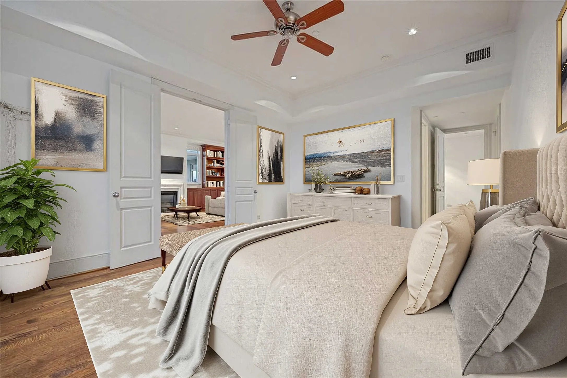 View of second bedroom with French doors leading to living area (virtually staged)