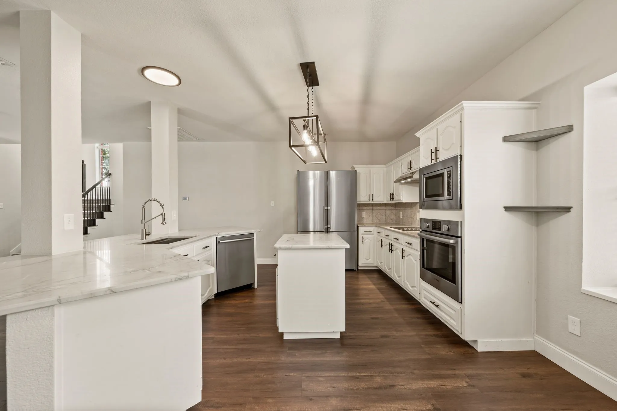 Counter depth stainless steel refrigerator included.