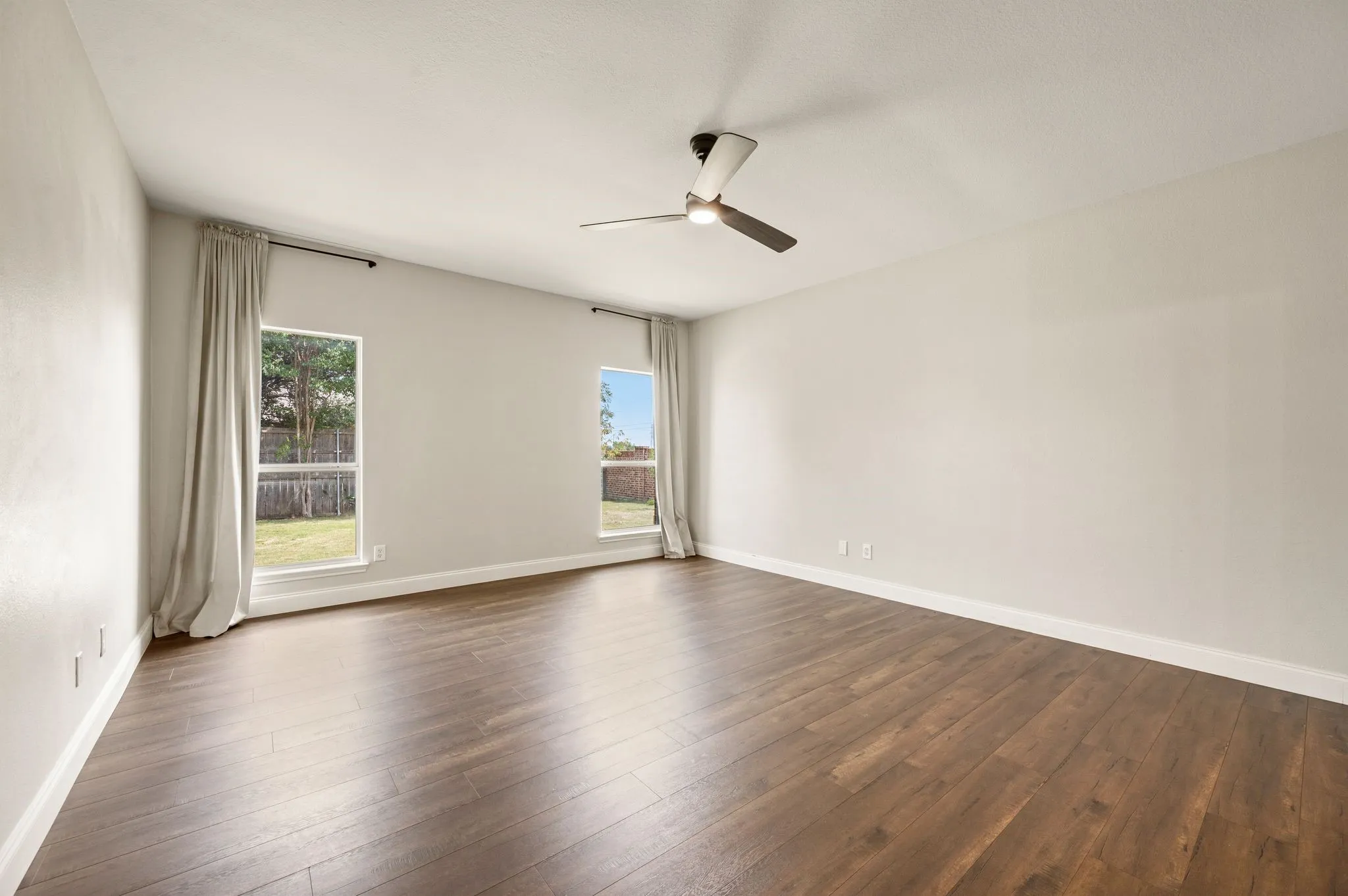 Oversized Primary Bedroom with room for additional seating.