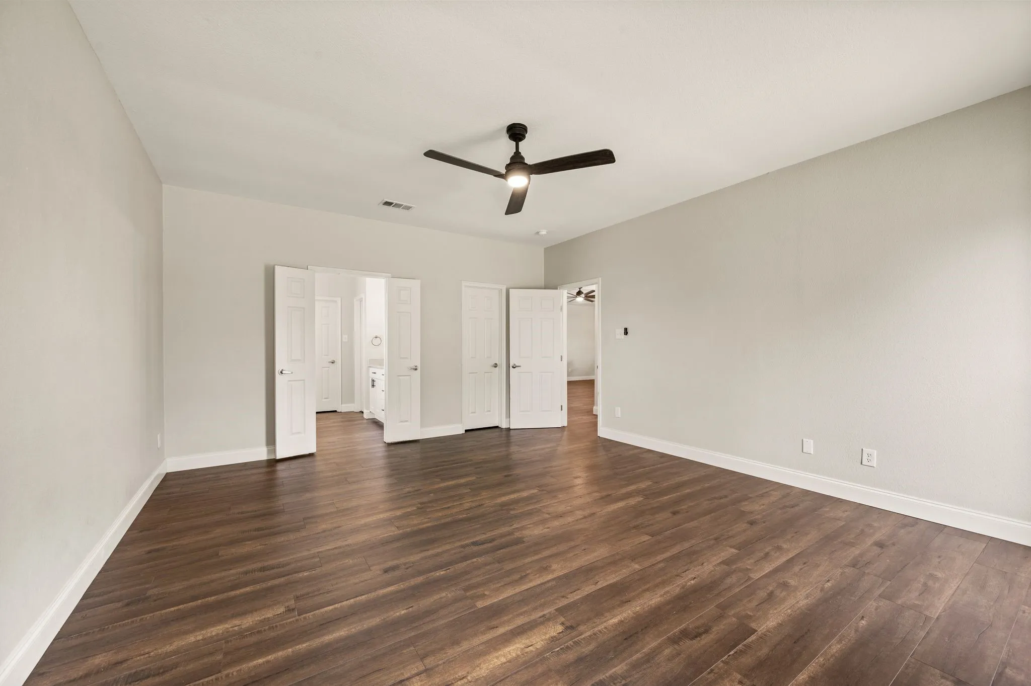 Oversized Primary Bedroom with room for additional seating.