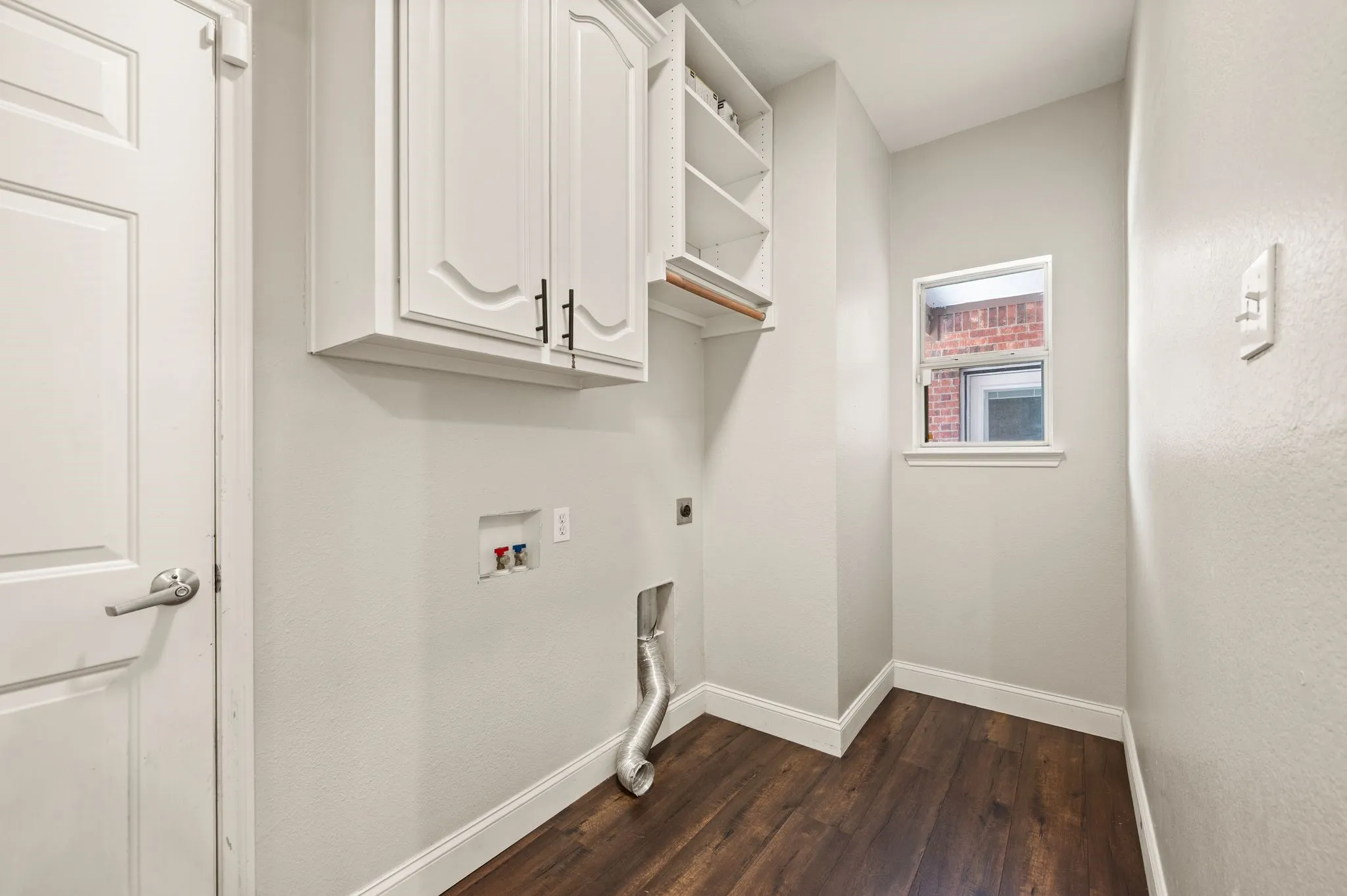 Plenty of room for full size washer & dryer.