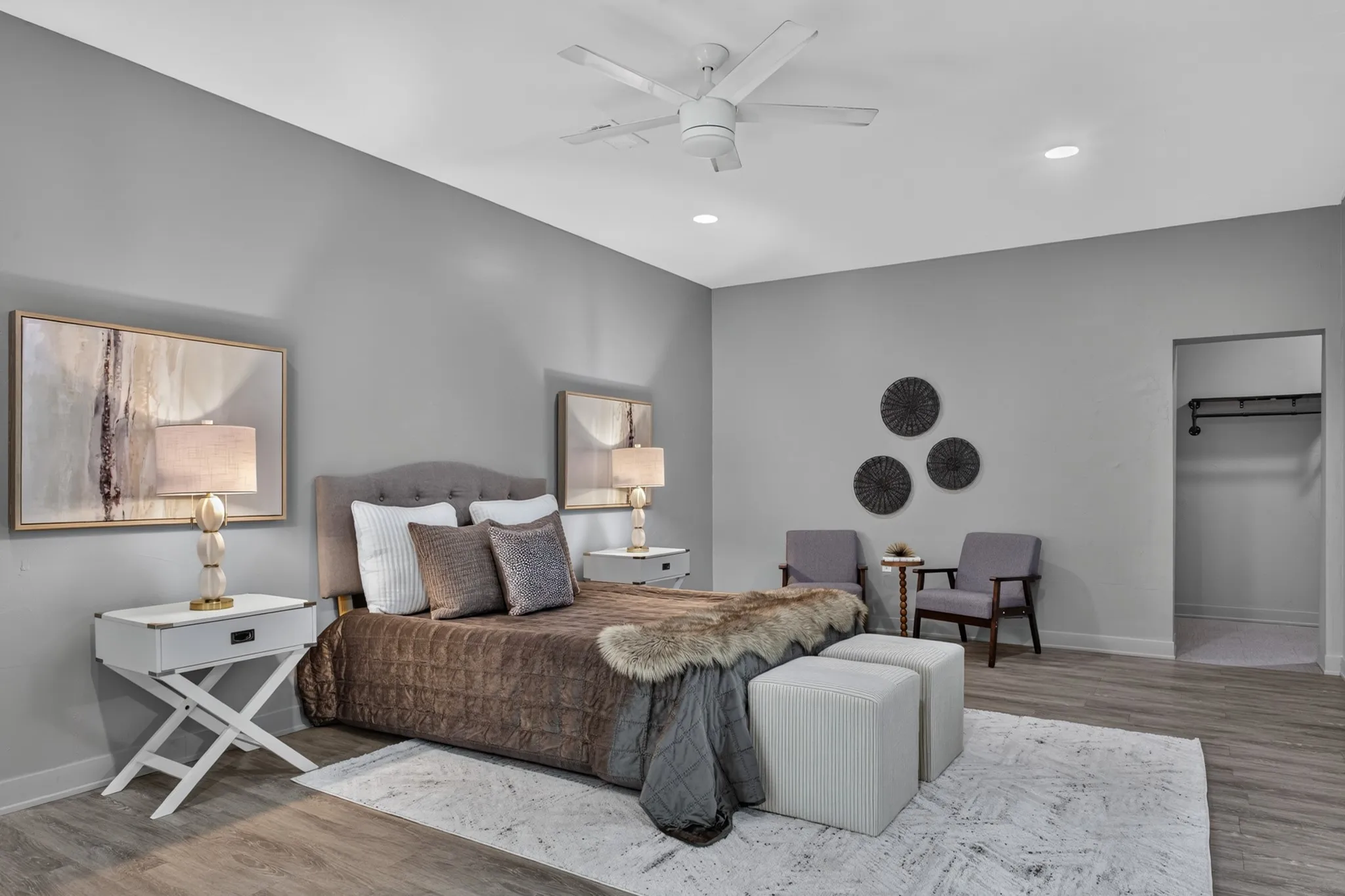 The main primary suite is a peaceful 20 x 22 retreat featuring picture windows, a custom walk-in closet with industrial pipe shelving and private access to its own covered patio. The beautifully remodeled ensuite bath features an oversized 11x8 seamless glass shower with designer tile.