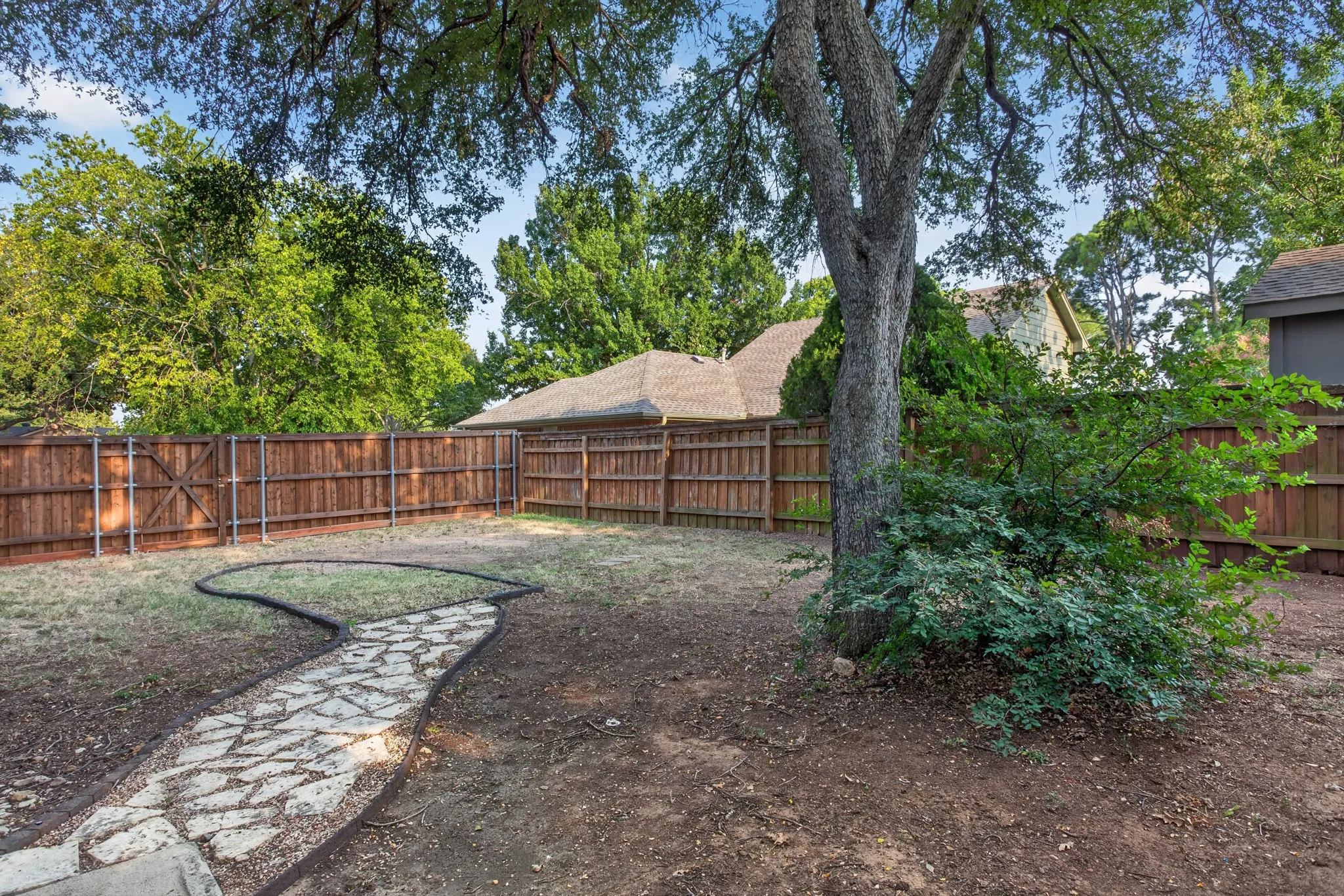 Step outside and enjoy multiple places to relax including extensive front porch areas, covered back patio and open patio all overlooking a peaceful backyard surrounded by a 6 and 8-foot cedar fence. A gated side yard provides RV or boat parking while mature trees create beauty shade and privacy throughout the property.