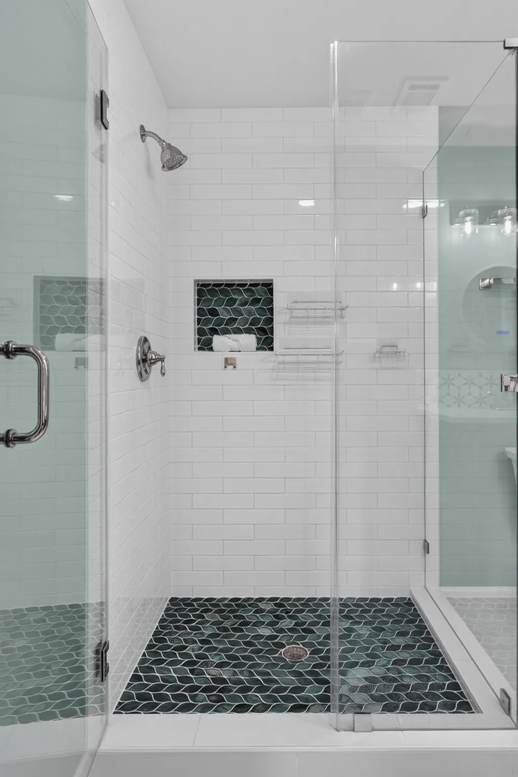 The second primary suite provides exceptional flexibility and ensuite bath showcases quartz, green leaf custom accented and subway tile surround the seamless glass shower, illuminated LED mirror updated lighting, large walk in closer with built ins.