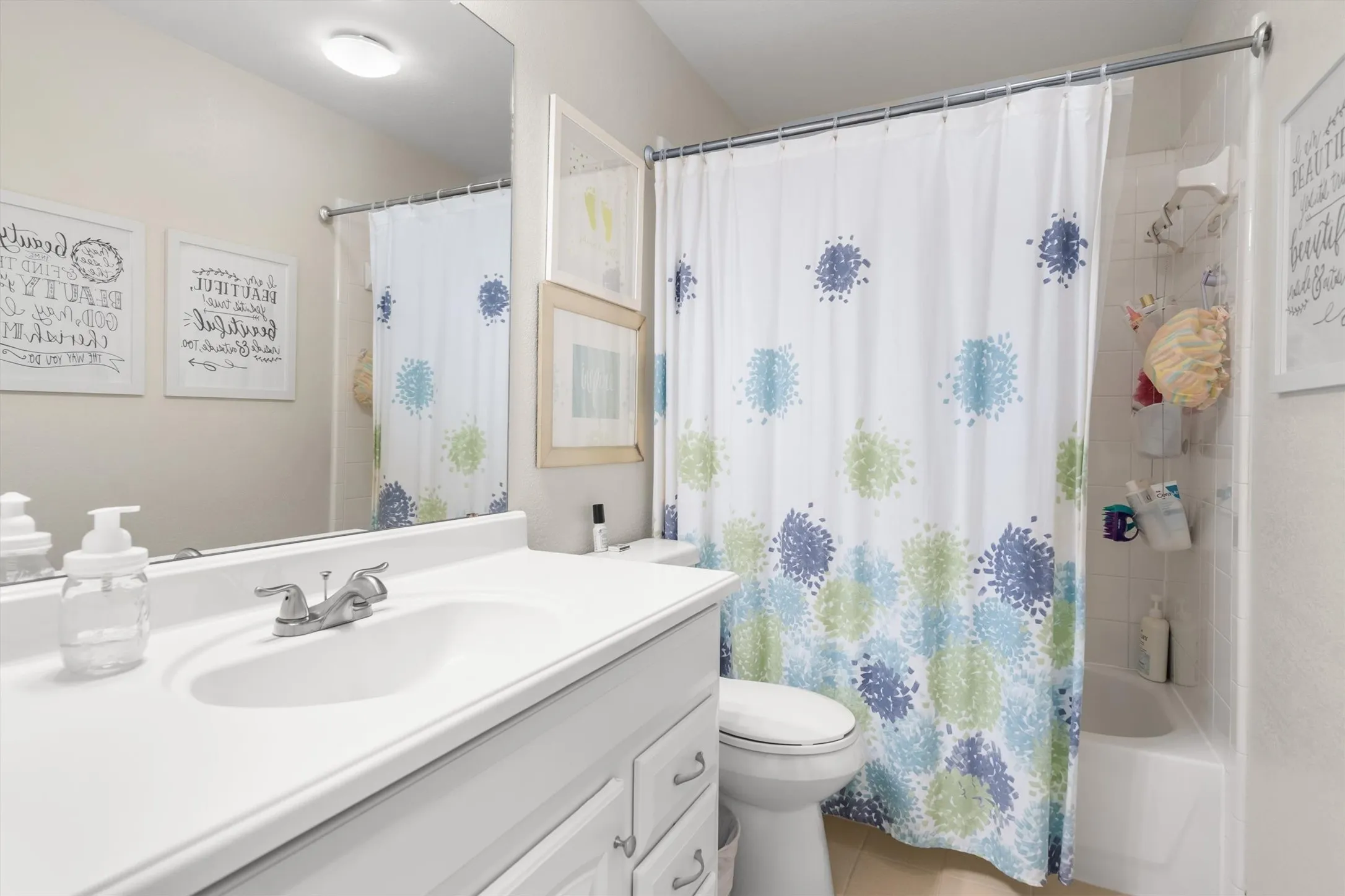 White vanity with an integrated sink and chrome faucet