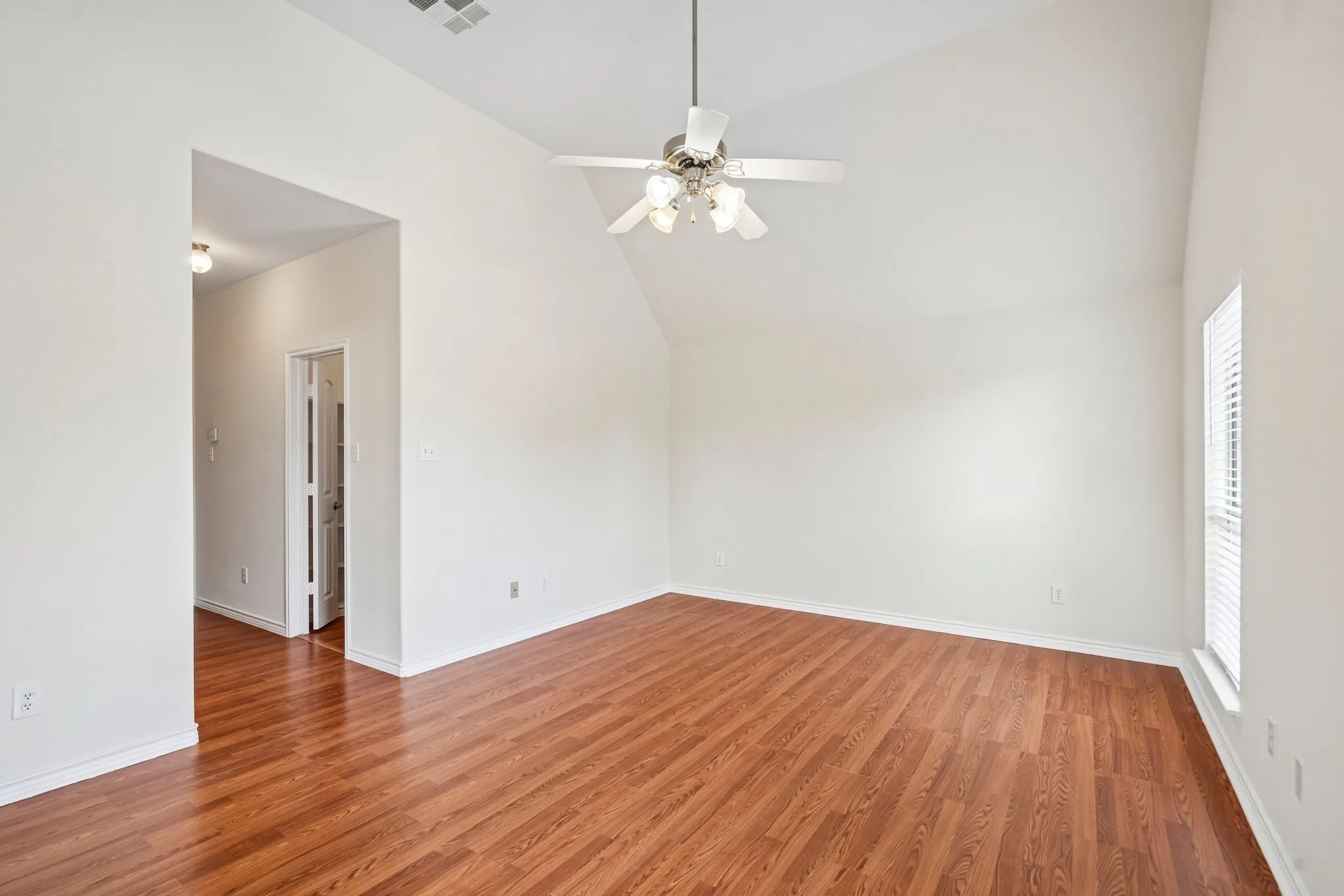 Bright Primary Bedroom with vaulted ceilings
