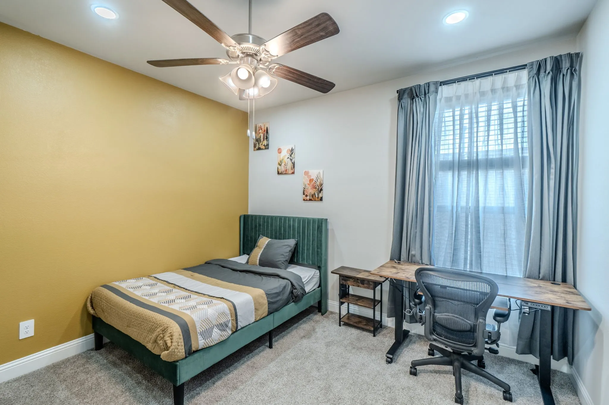 Recessed lighting, ceiling fan with light fixture, carpeted flooring, window with blinds and curtains, and a two-tone wall finish