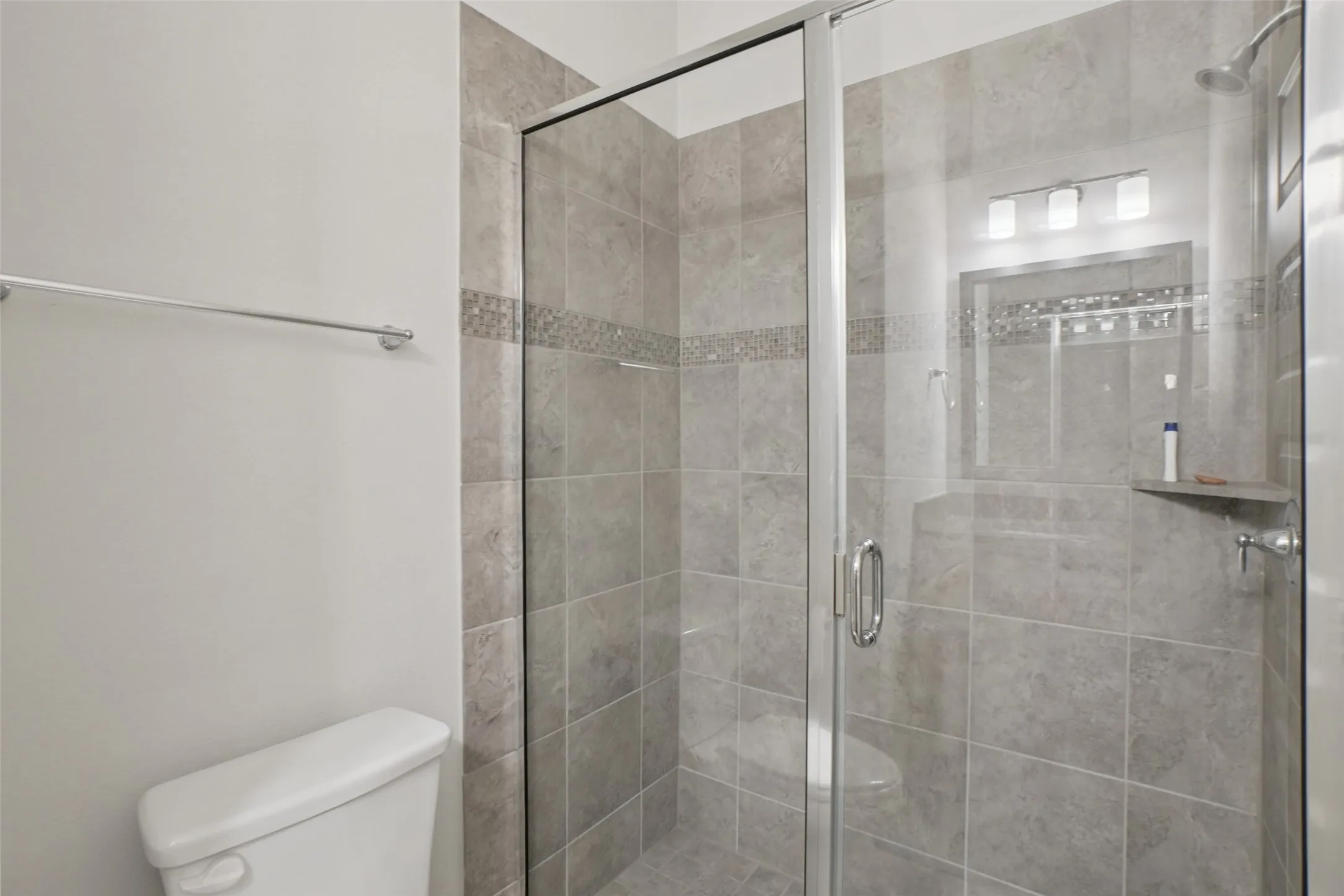 Bathroom with toilet and a shower stall