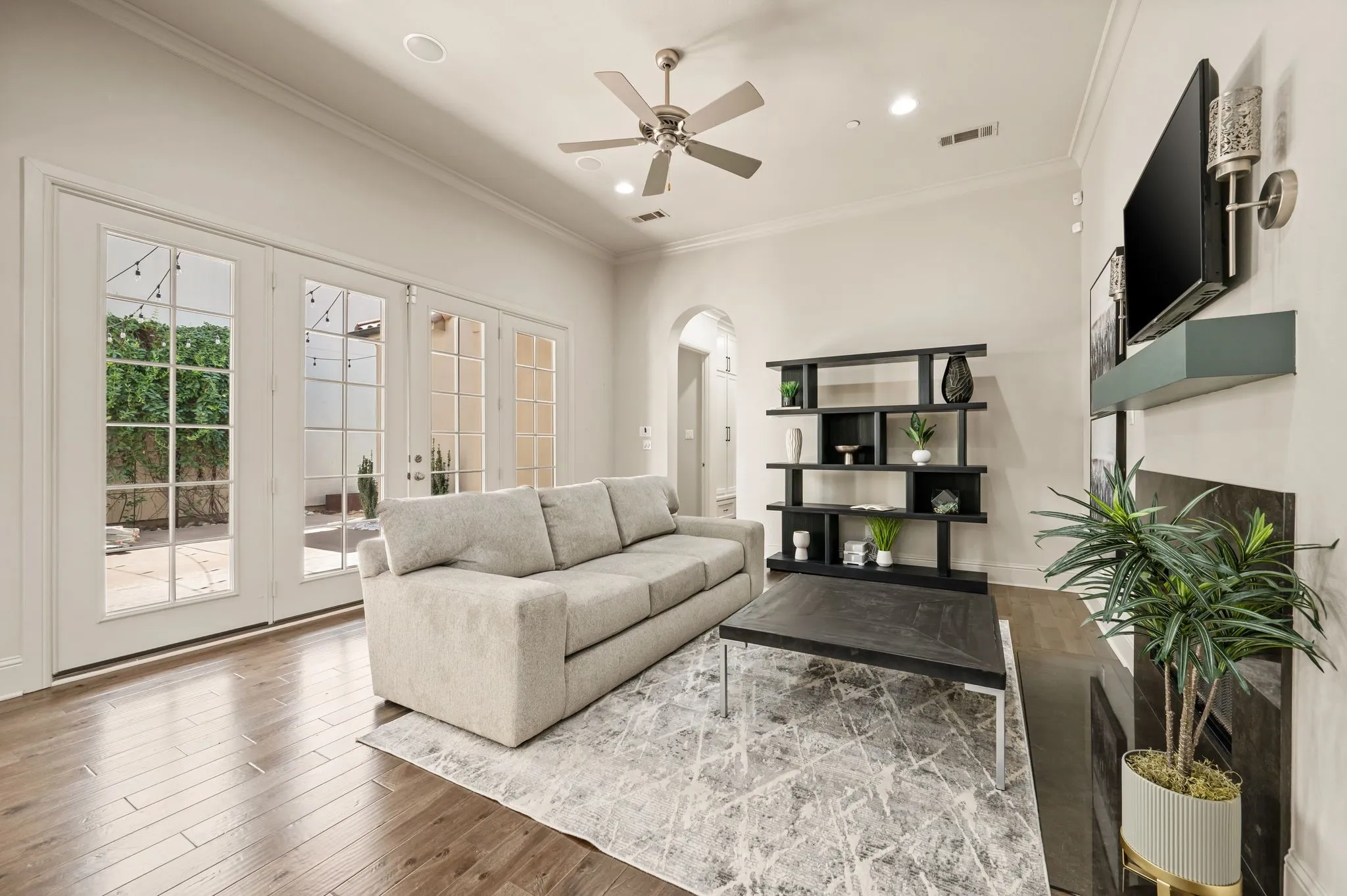 Hardwood flooring, recessed lighting, and a ceiling fan
