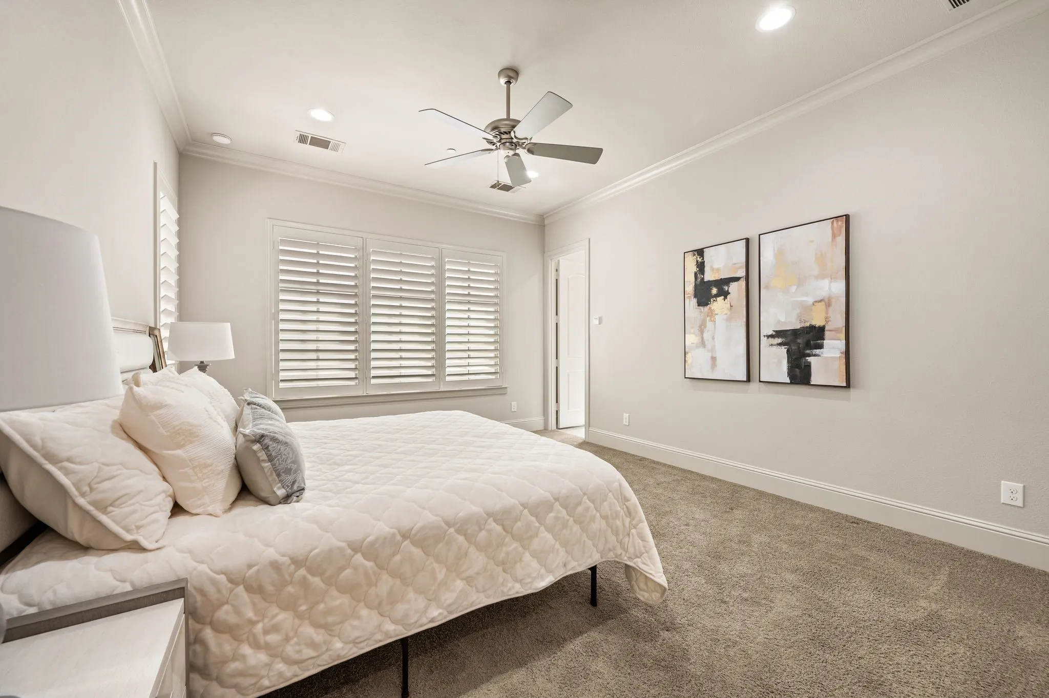 Recessed lighting, crown molding, ceiling fan, carpeted flooring, and window shutters
