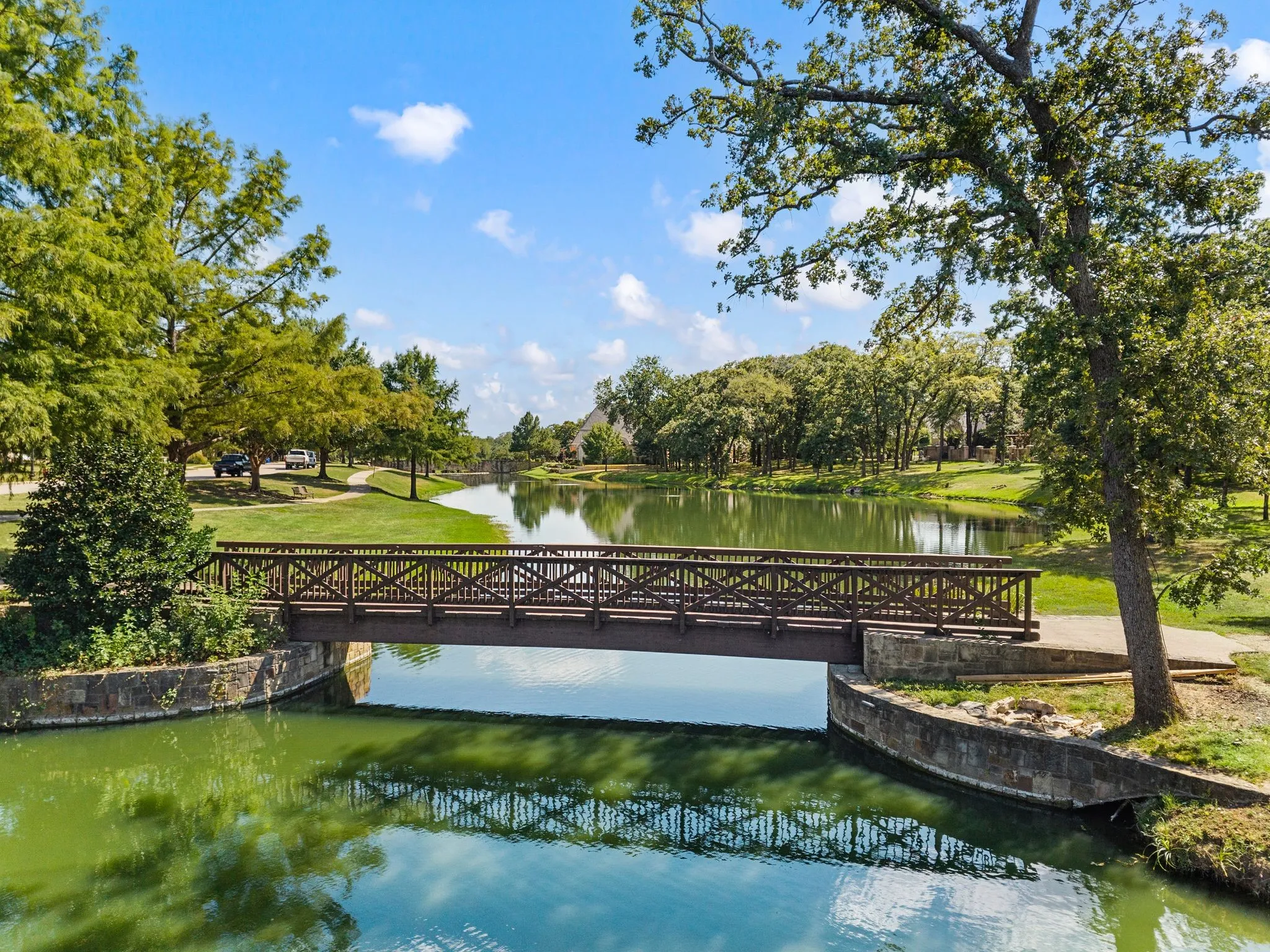 Community pond with quaint bridge