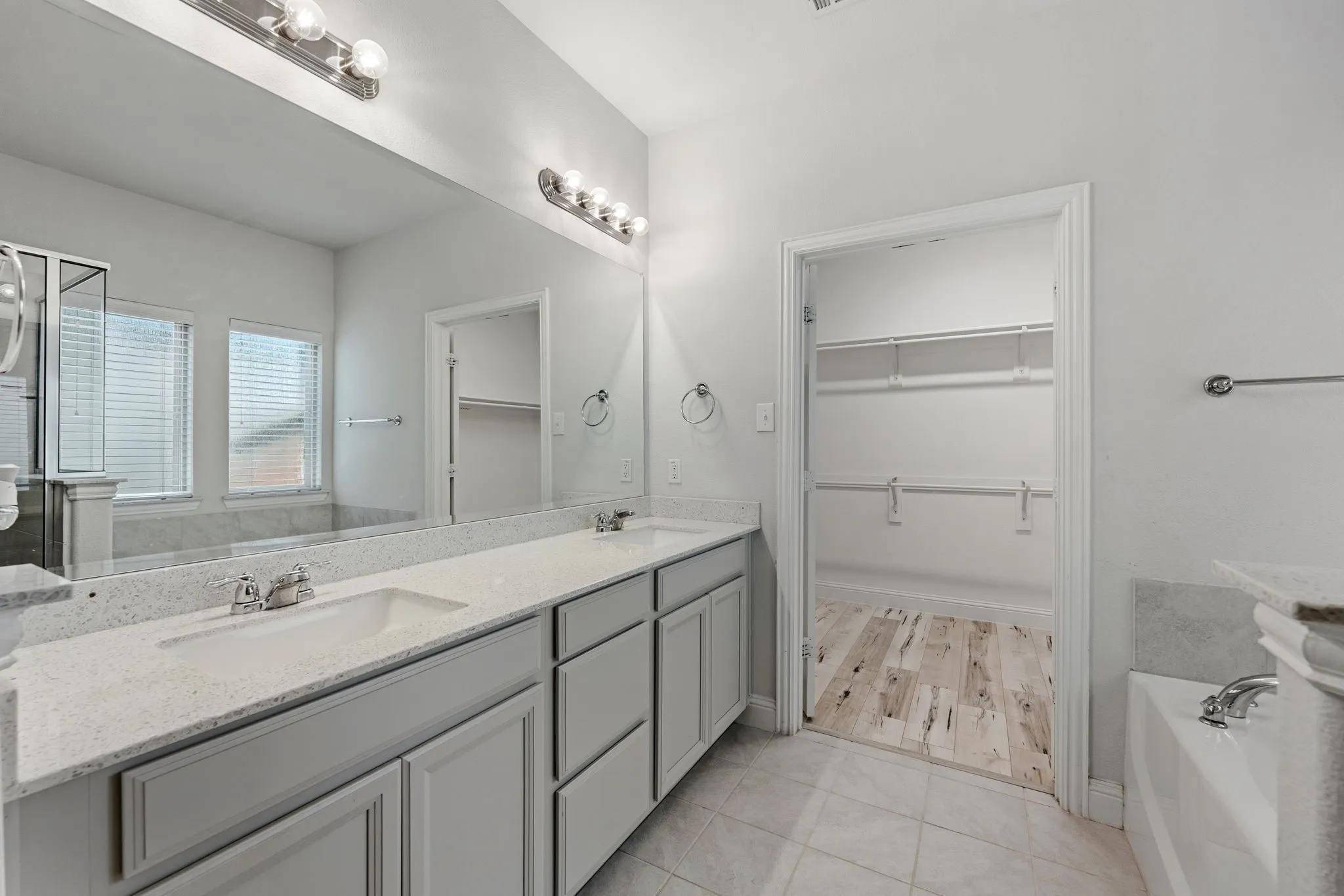 Dual vanity with granite-style countertops and undermount sinks