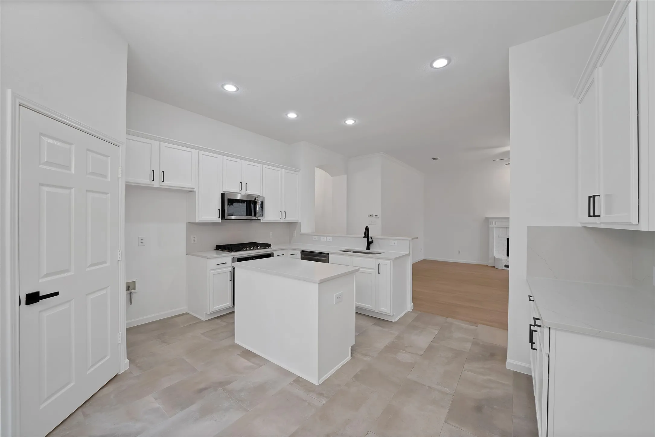 Kitchen cabinets have been recently painted and hardware added.