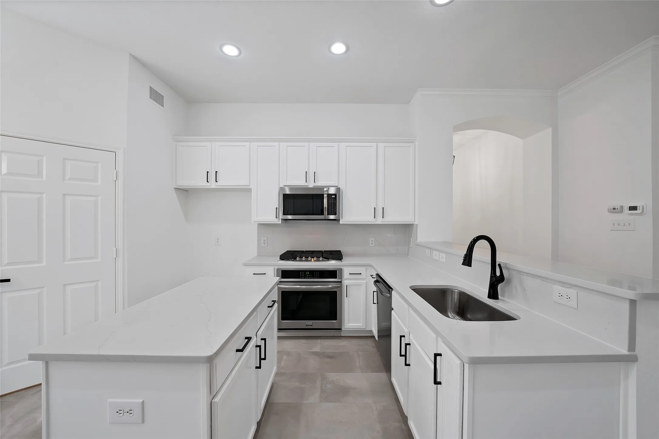 Stainless steel appliances.  5 burner gas cooktop and microwave are new.
