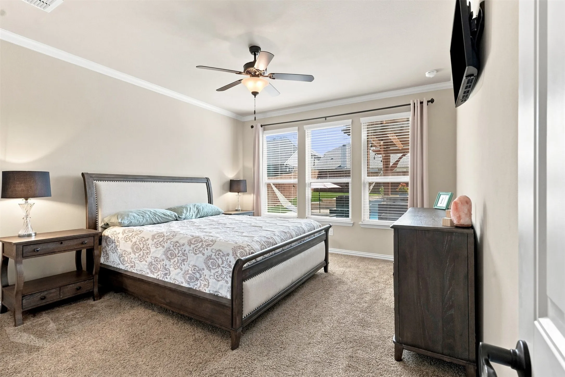 Spacious with Private Hallway Entrance, Crown Molding, and view of Resort-style backyard.