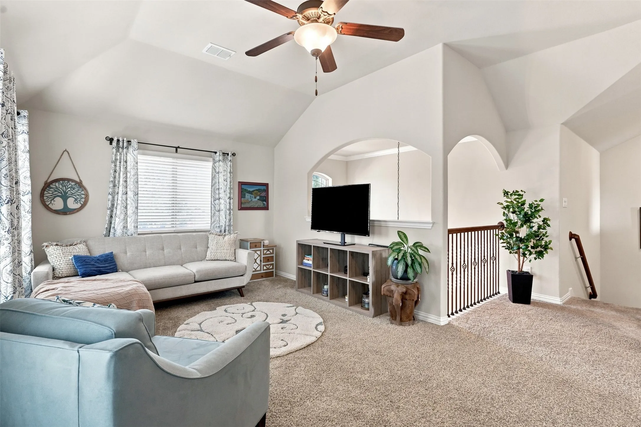 Secondary Living Area on Second Floor with Vaulted Ceilings and Large Windows,