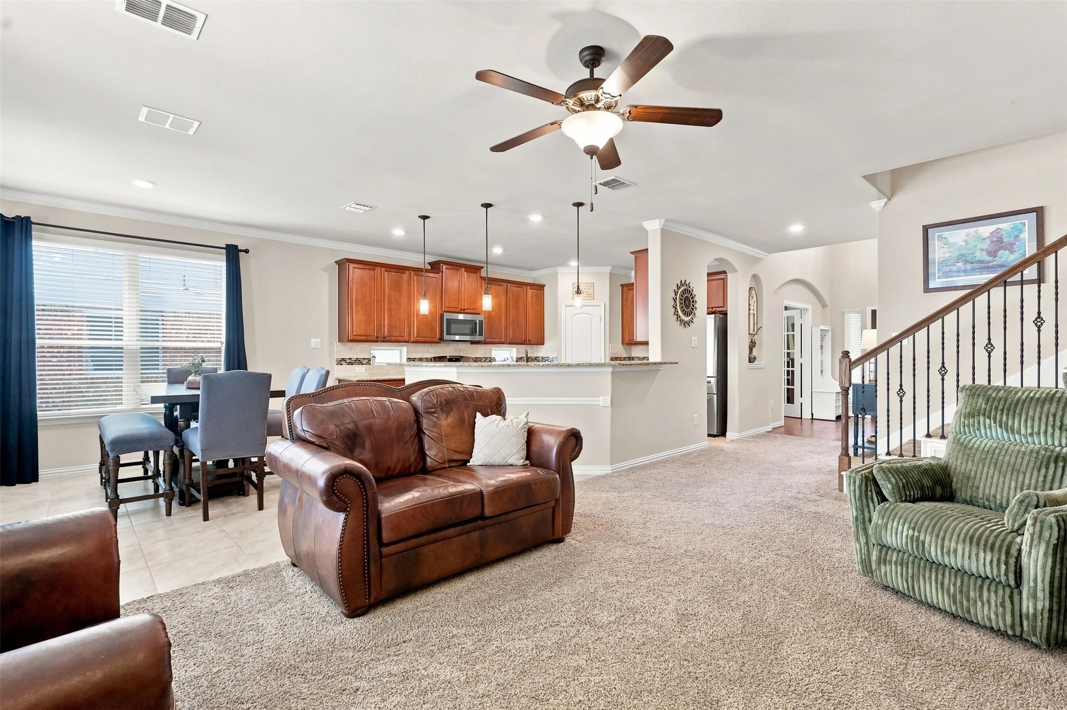 Open Floor Living Plan. Living Room opens into Dining Area and Kitchen.