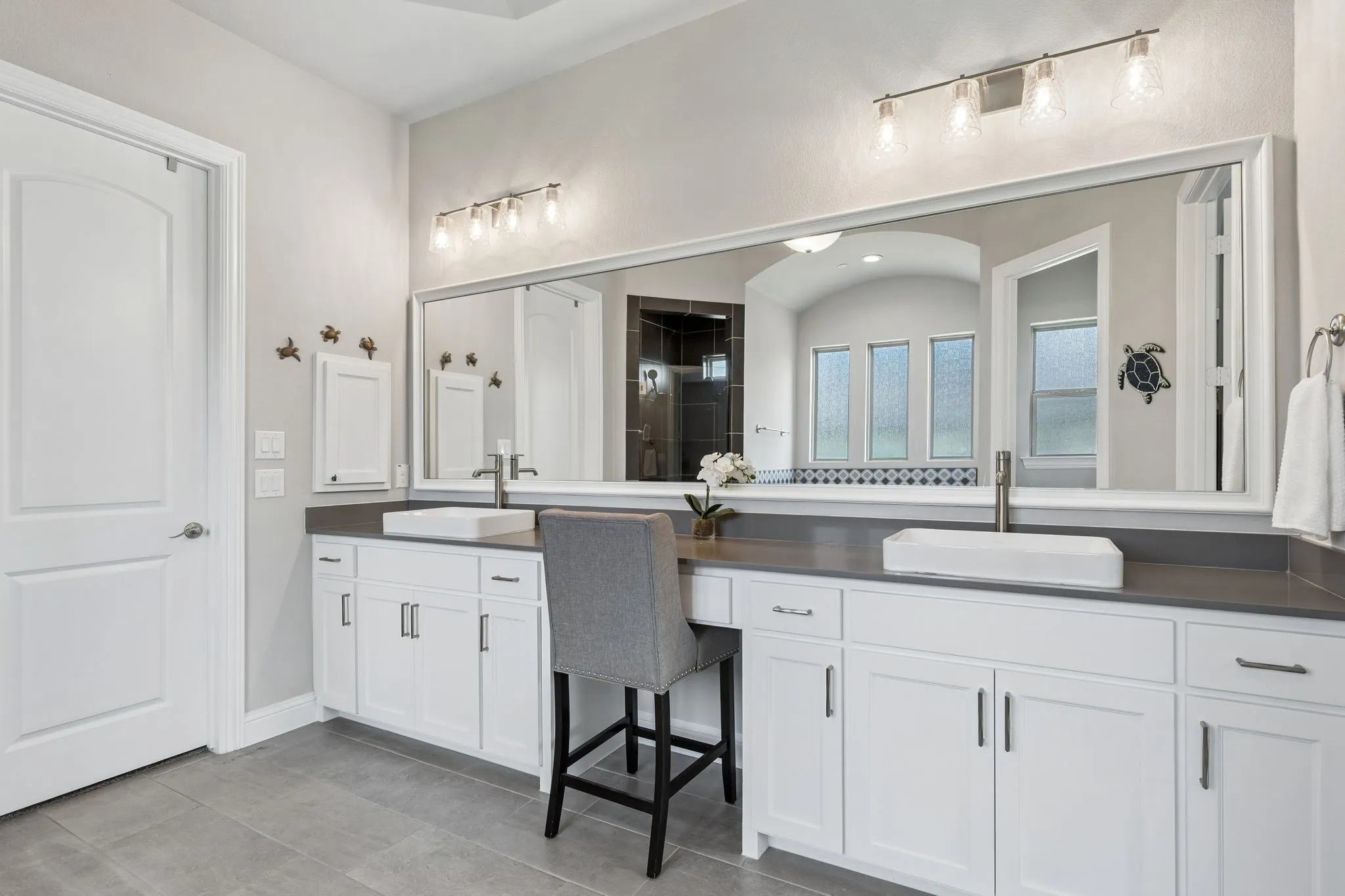 Primary Bathroom has dual sinks, quartz countertops