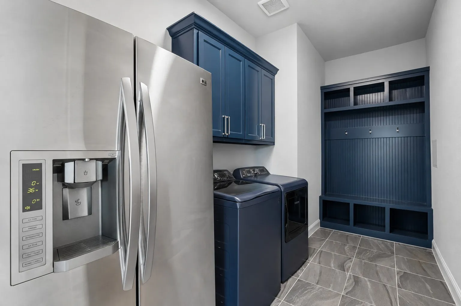 Utility Room w/built in Mud Bench and Upper Cabinets. Also room for a fridge!