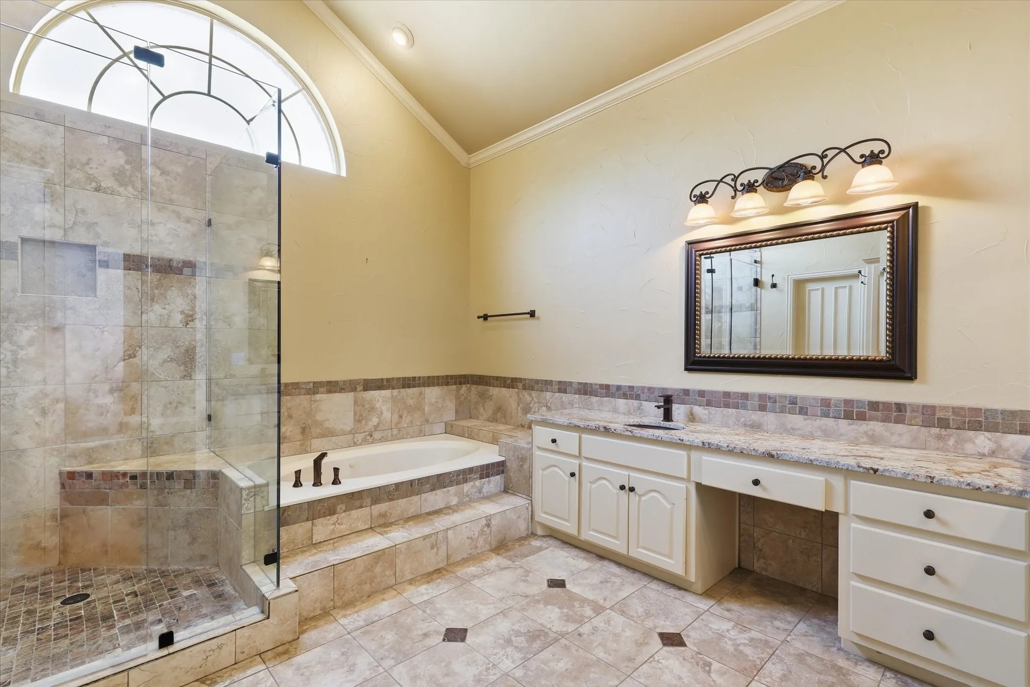 Another view of the primary bath highlighting the oversized walk-in shower and generous layout.