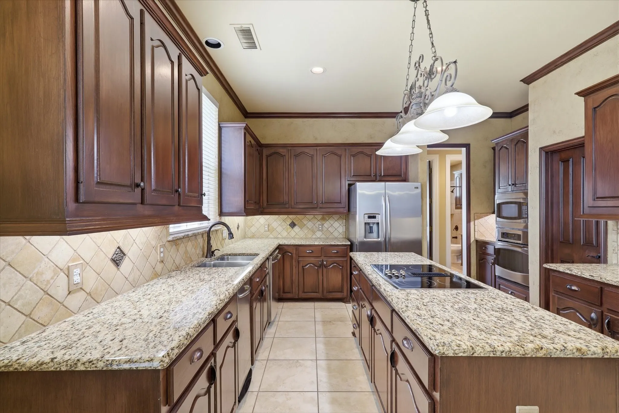 The center island provides additional workspace while keeping the kitchen open to the main living areas.