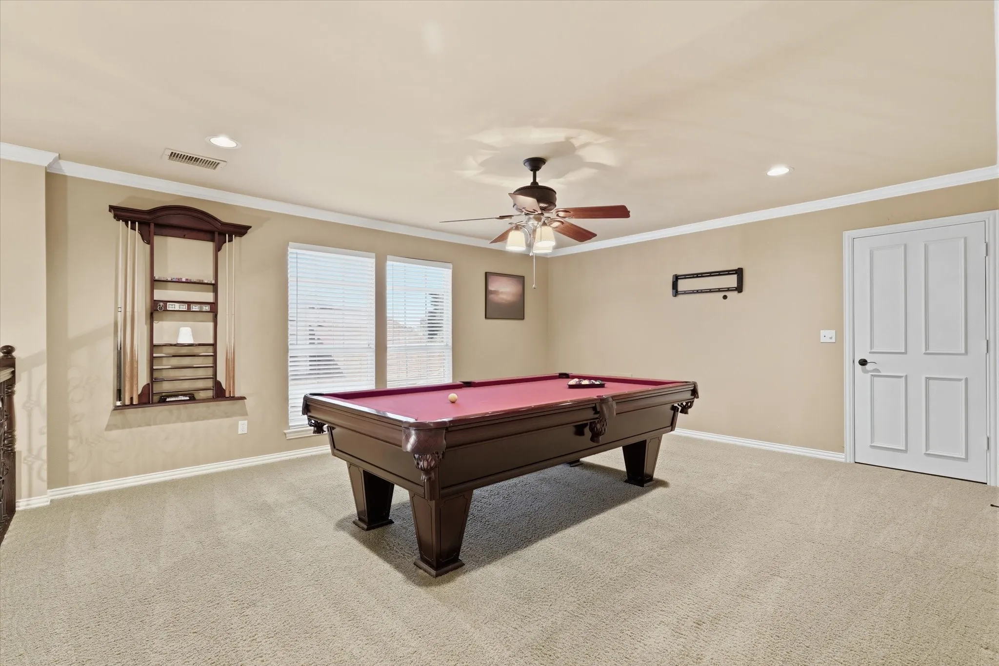 Spacious upstairs game room offers endless possibilities for recreation, media or hobbies.  Pool table does convey with the sale.