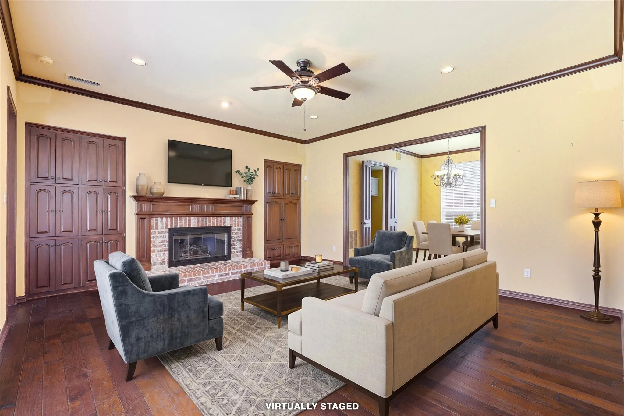 Virtually Staged. This image illustrates one possible furniture layout to help buyers envision the scale and functionality of the family room.