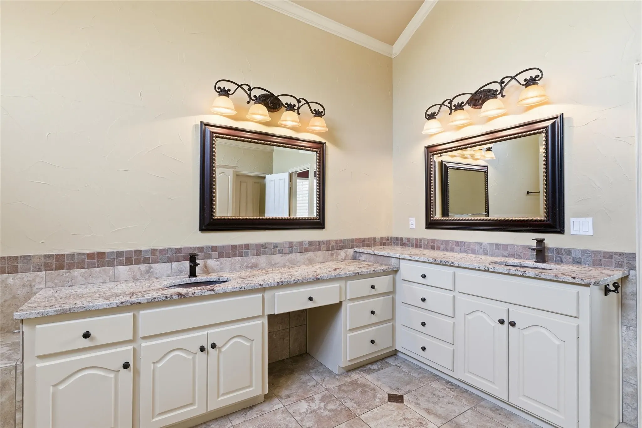 Dual sinks and extensive cabinetry provide convenience and plenty of storage.