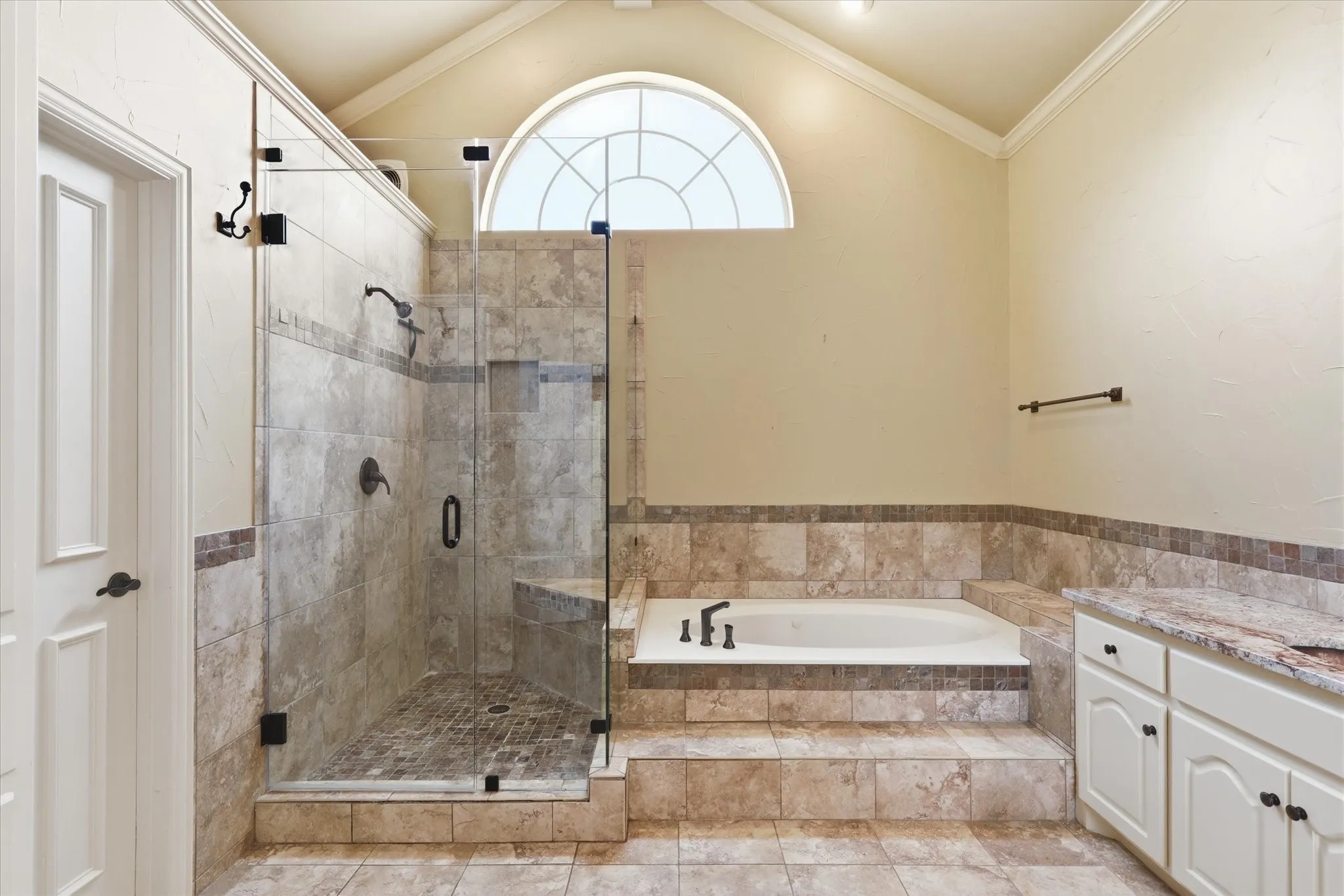 The beautifully designed walk-in shower creates a true spa-like retreat.