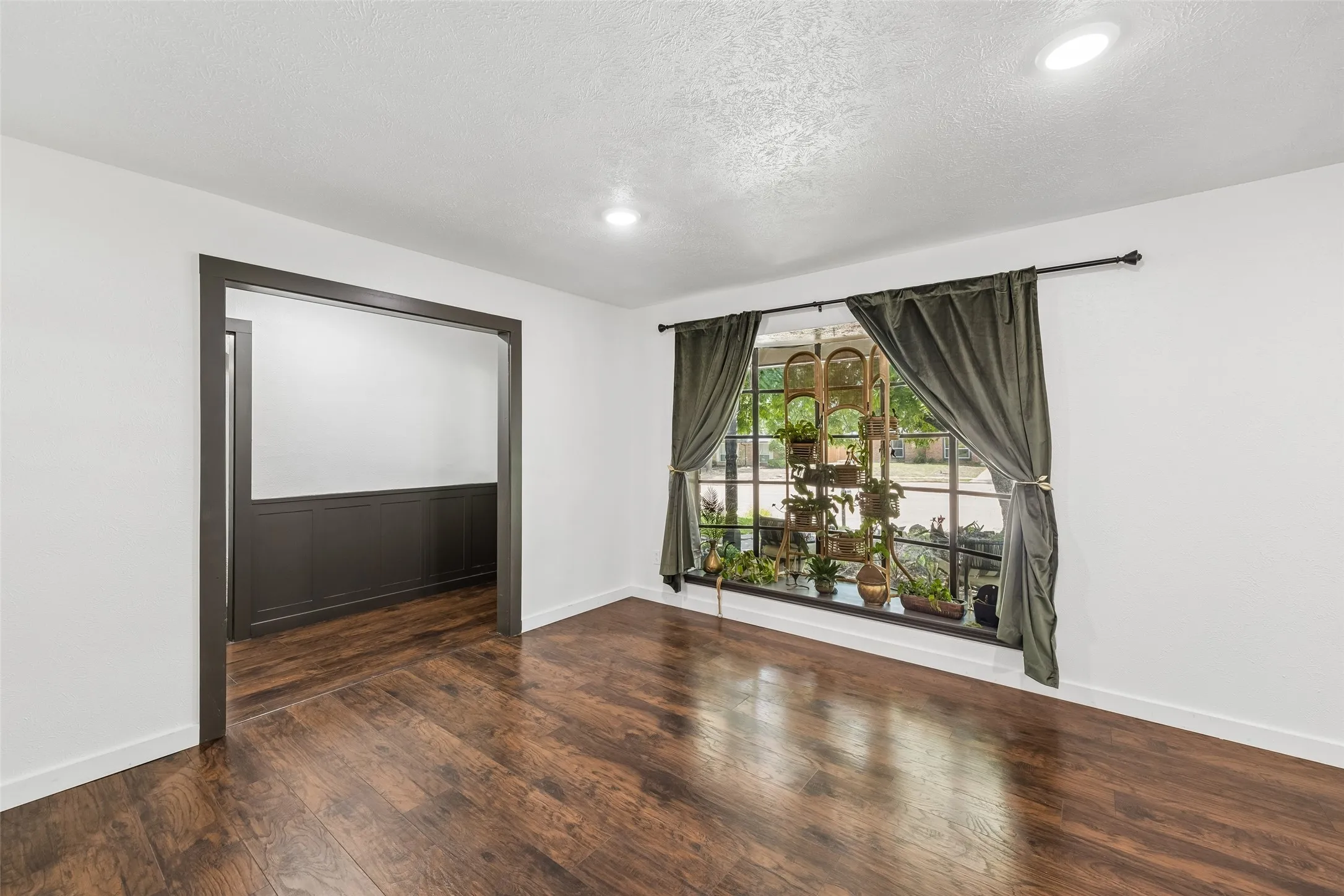 Front living area off of the foyer with a bay window