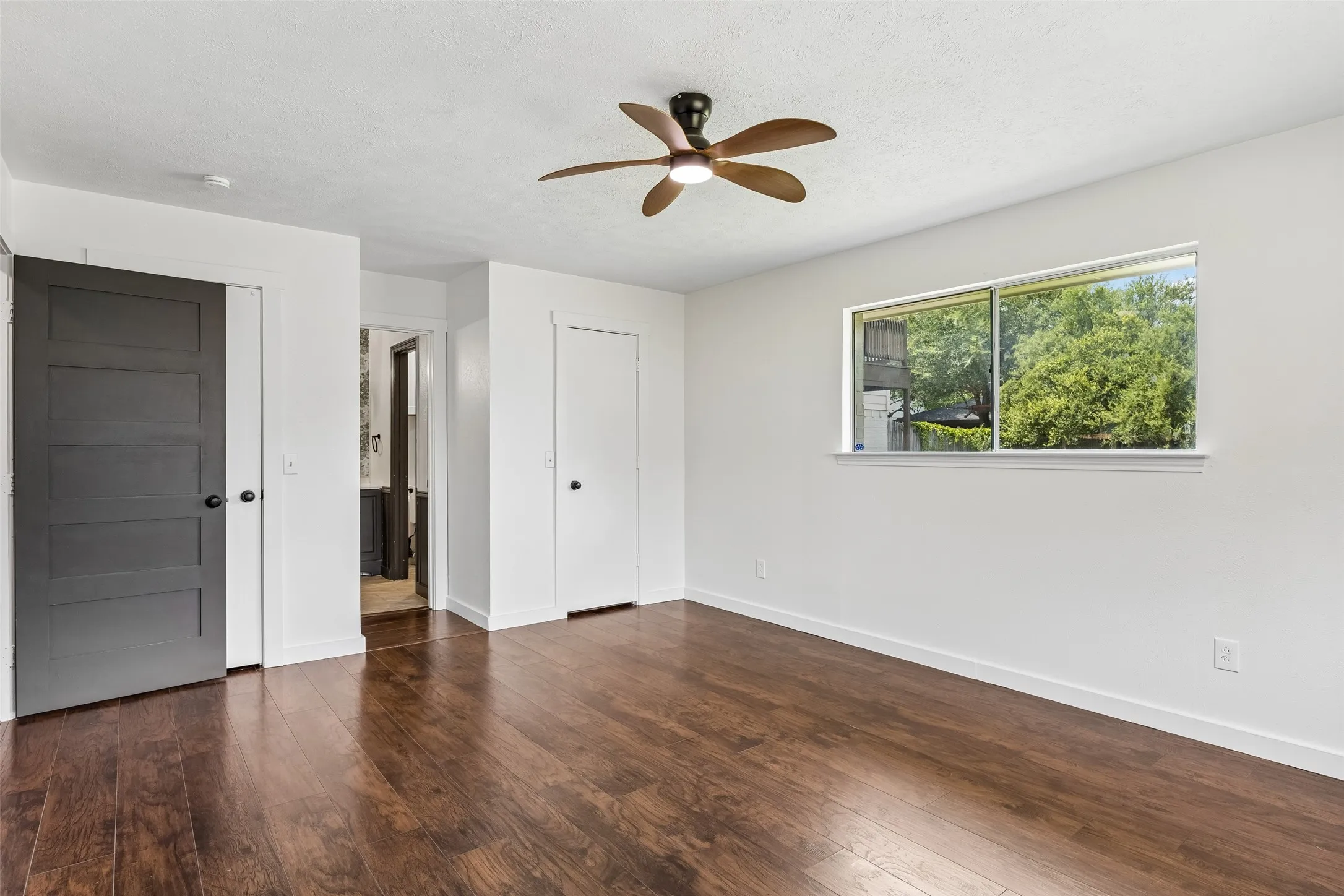 Dual closets connect to a full bath