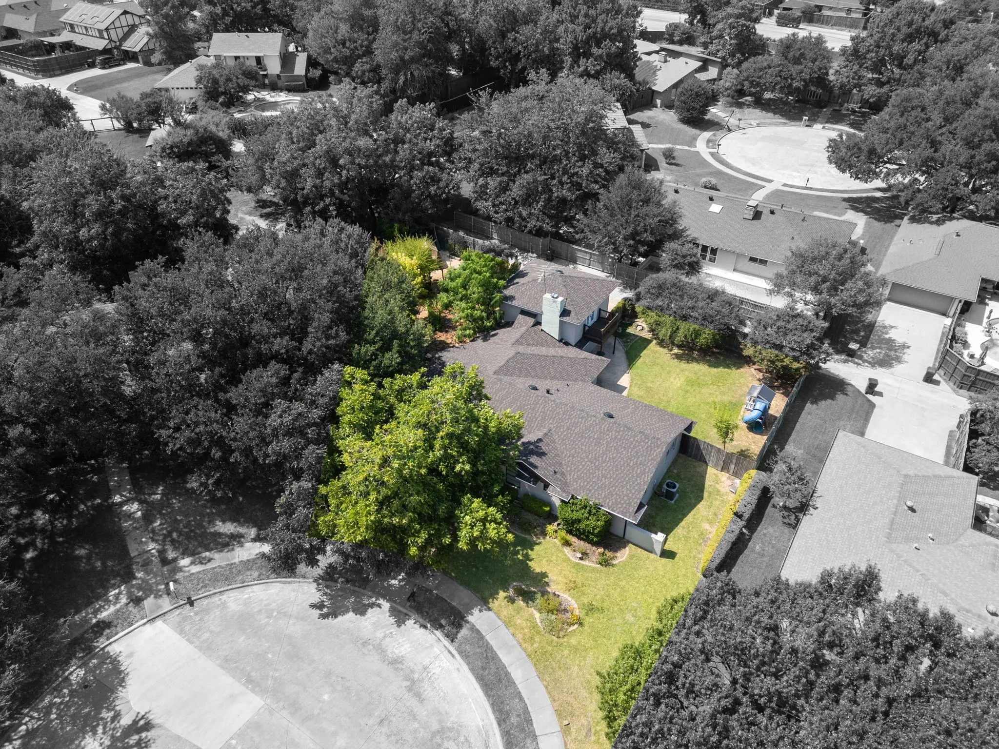 Spacious property with a large backyard featuring a manicured lawn and mature trees