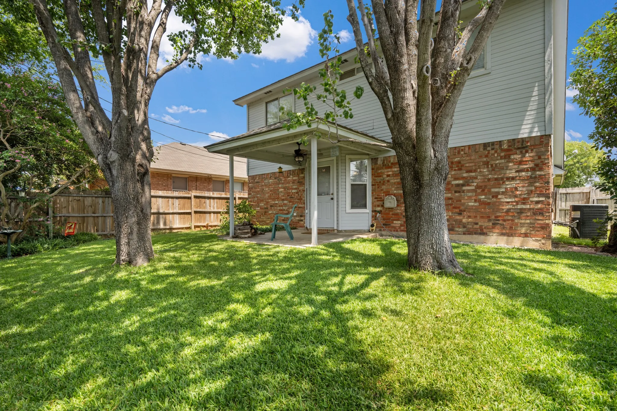 Pretty treed backyard with plenty of room for your outdoor activities.
