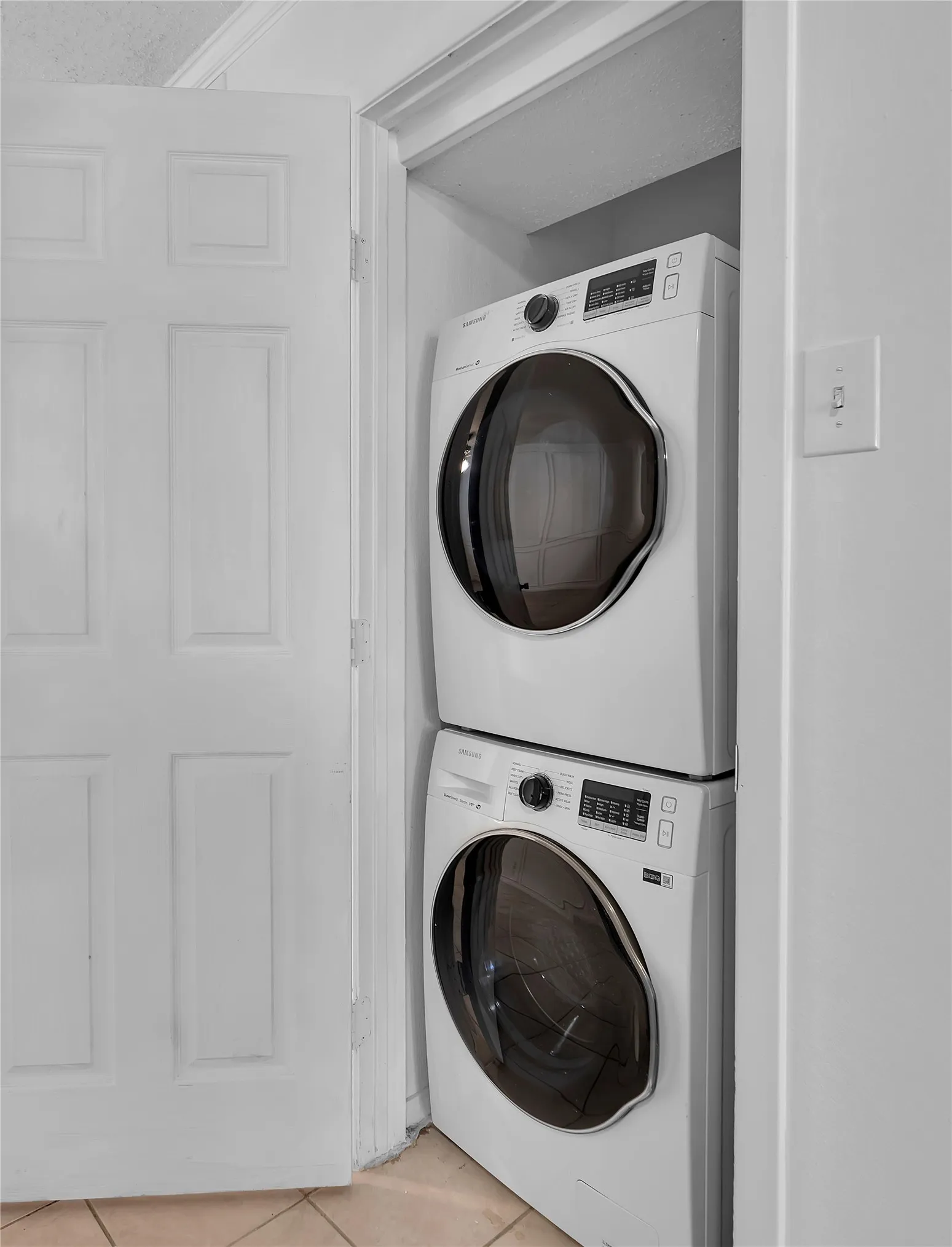 Stacked front-load washer and dryer units