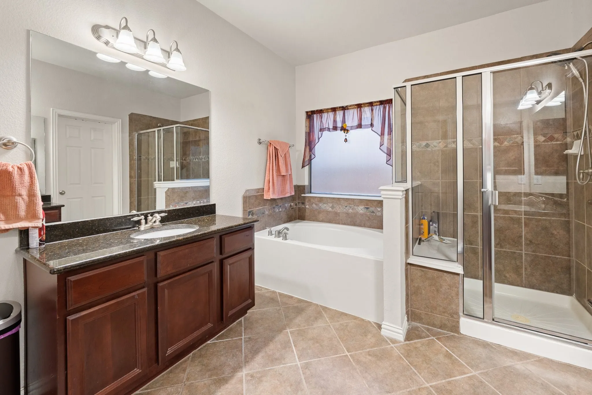 Primary Ensuite BATH features Soaking Tub, Separate Shower, DUAL Vanities each with its own SINK (located across from each other), and WALK-IN Closet (not shown).