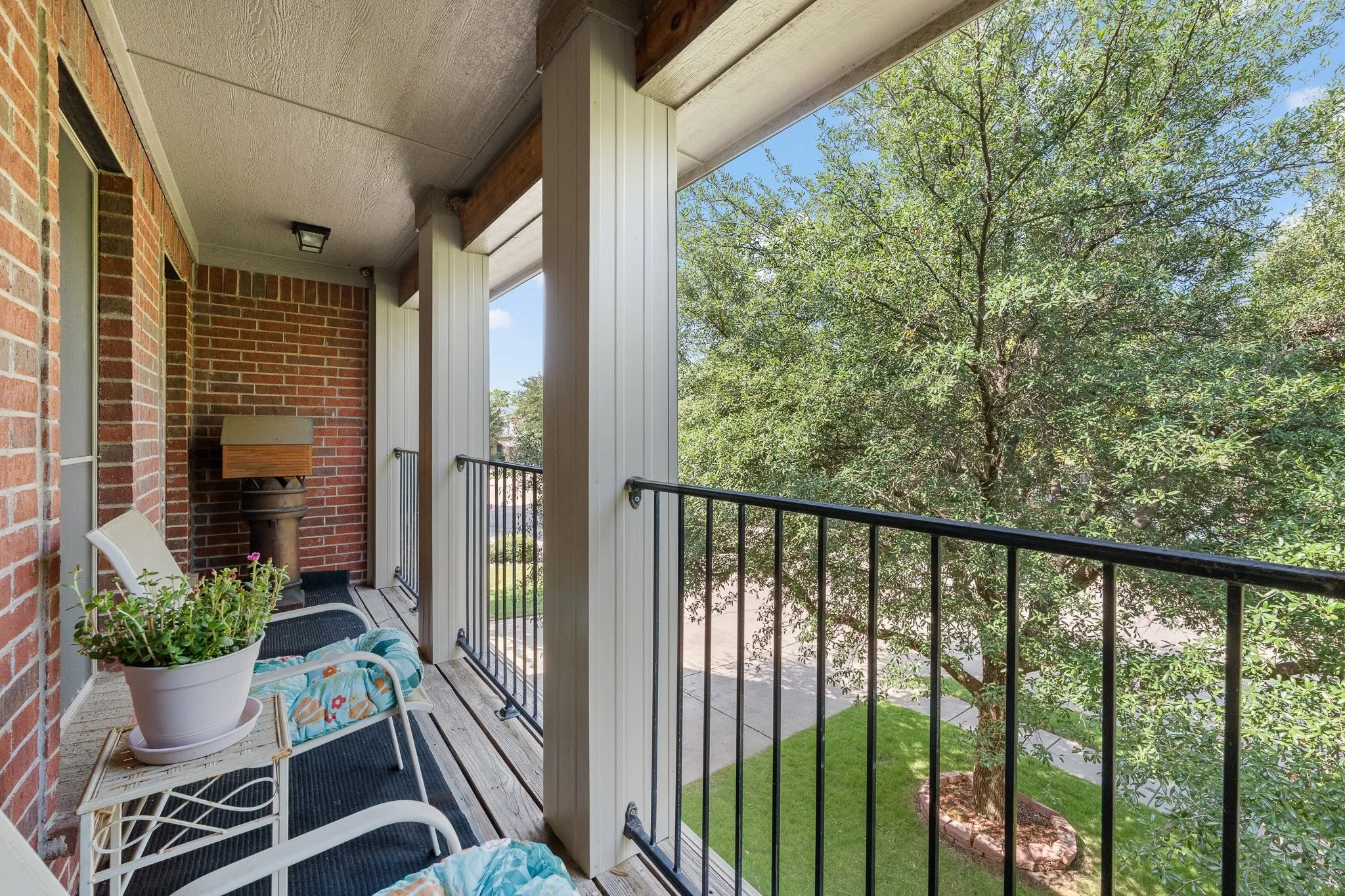 Upstairs Balcony Front Porch features black wrought iron railing... access from Media Room.