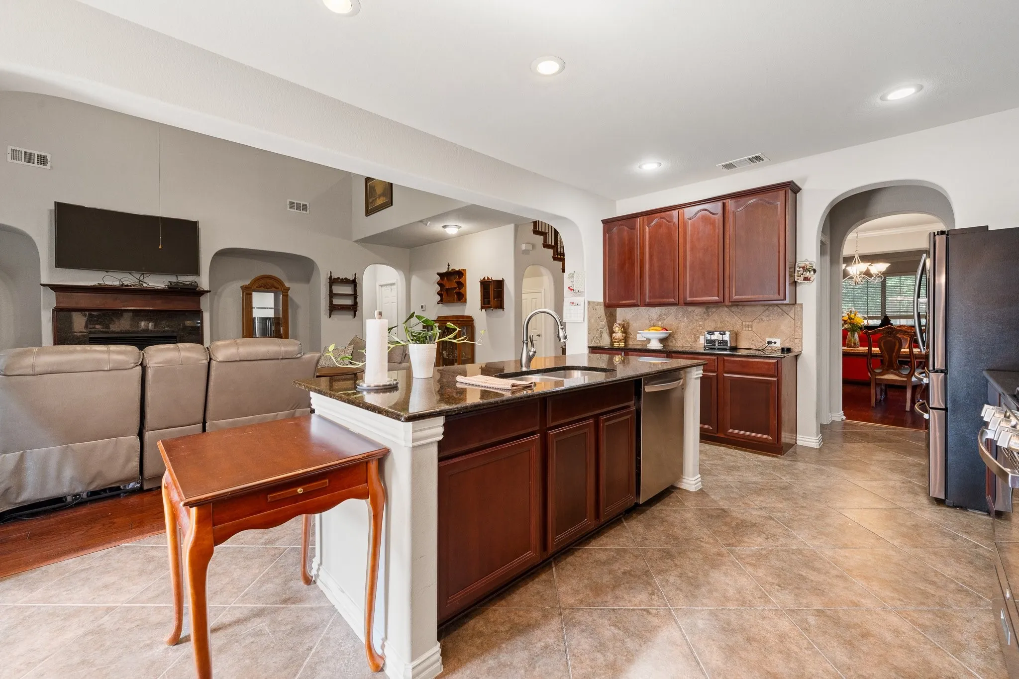 Kitchen Island is a perfect Prep & Serving space for Entertaining and Every Day! Integrated sink & disposal, granite countertops, and stainless-steel dishwasher too!