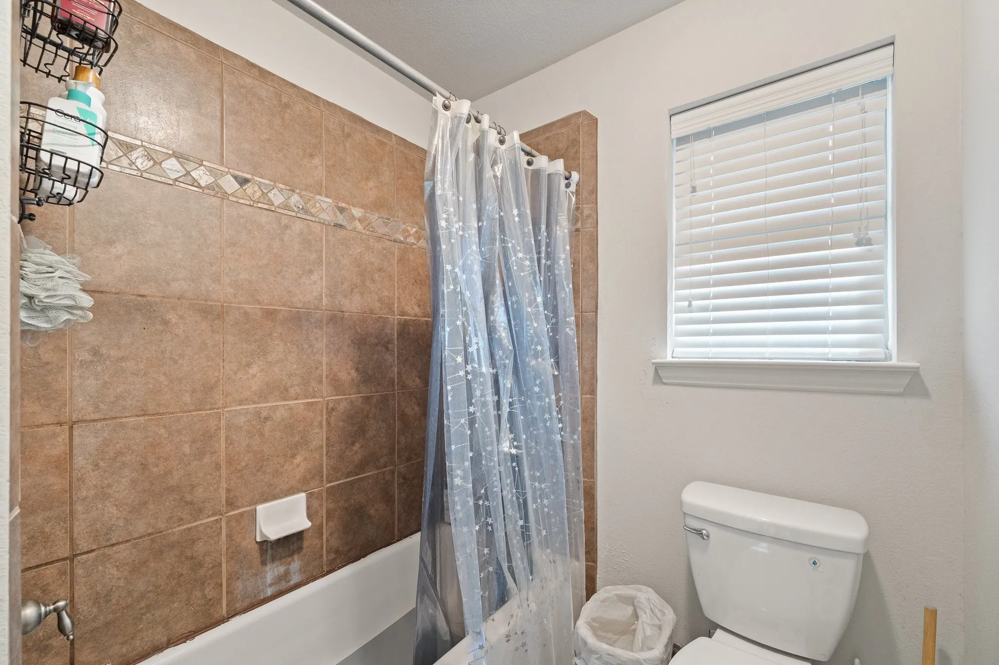 Upstairs 3rd Full Bath: tiled Tub/Shower Combo and Potty area with privacy door serves 3 Upstairs Bedrooms!