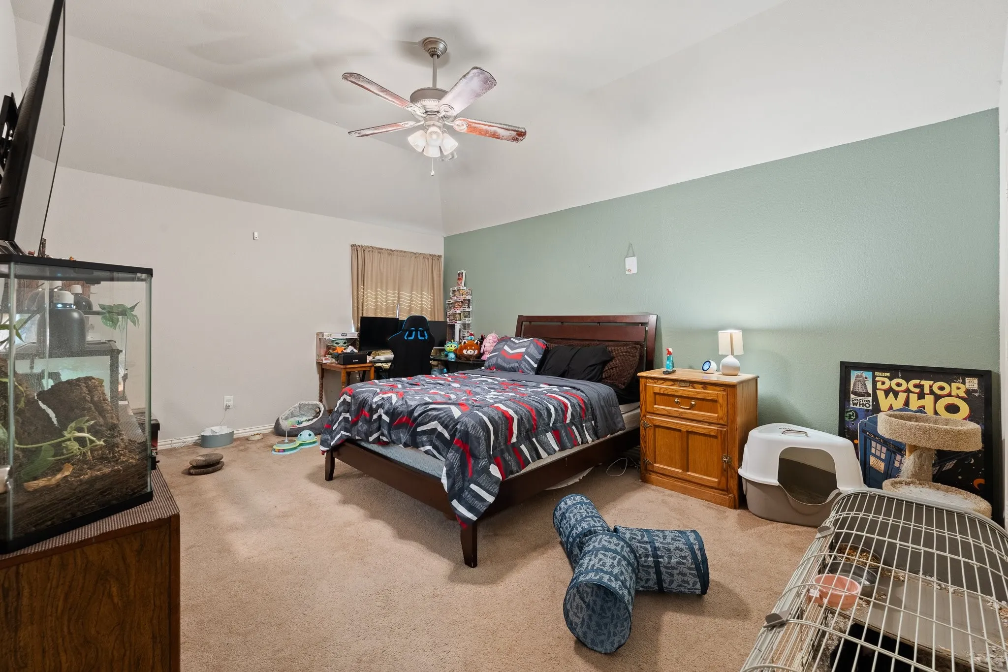 Upstairs Bedroom 4: Vaulted ceiling with a ceiling fan light fixture, carpeting, and a two-tone painted wall