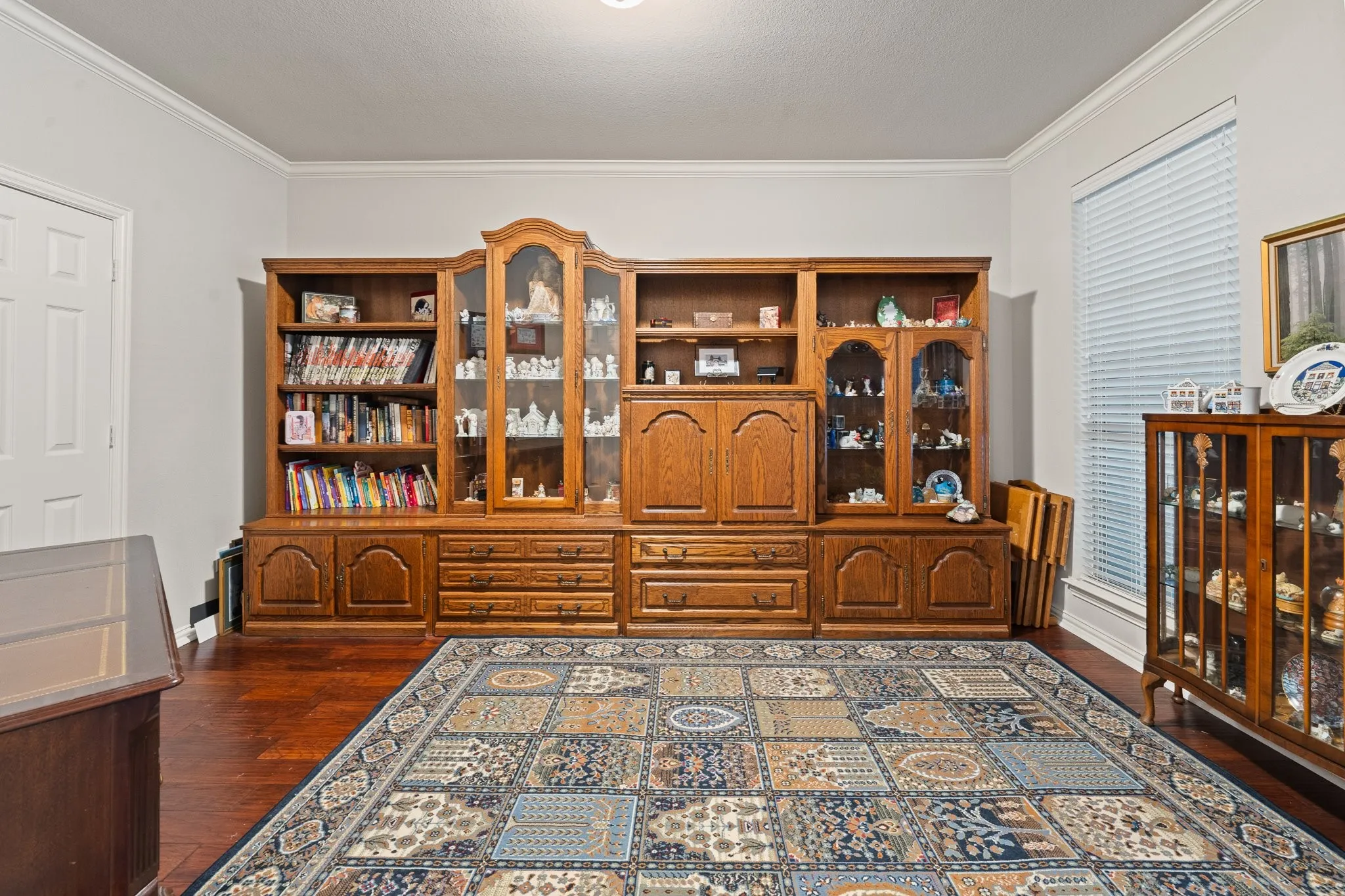 Downstairs Bedroom 2 near entry offers large Walk-In Closet; currently being used for Seller's Collectibles but would also be a great Office, Home School Room, or Exercise Room!