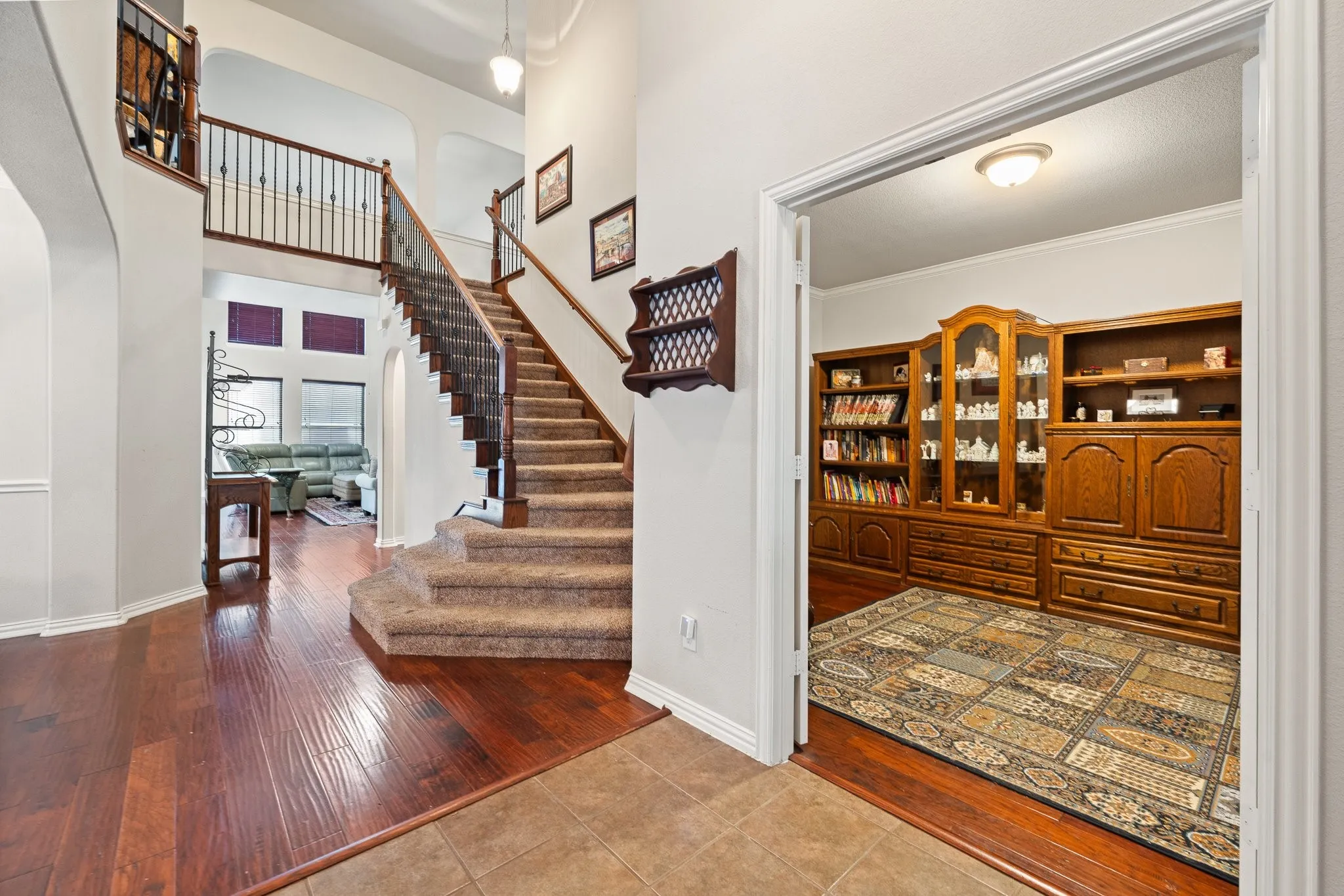 Beautiful Entry OPENS to Formal Living & Dining, Staircase, AND Downstairs Bedroom with large Walk-In Closet and French doors... the first of 6 bedrooms!!