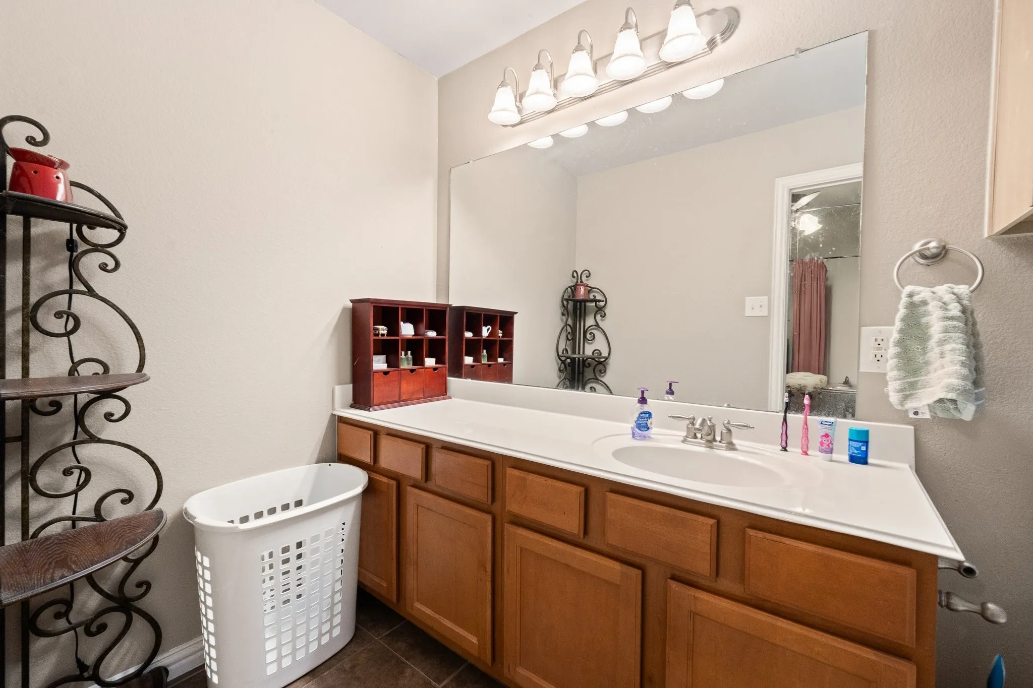 Private Ensuite FULL Bath opens to Upstairs 2nd Primary Bedroom... features tub/shower combo and toilet (not shown) adjacent to vanity.