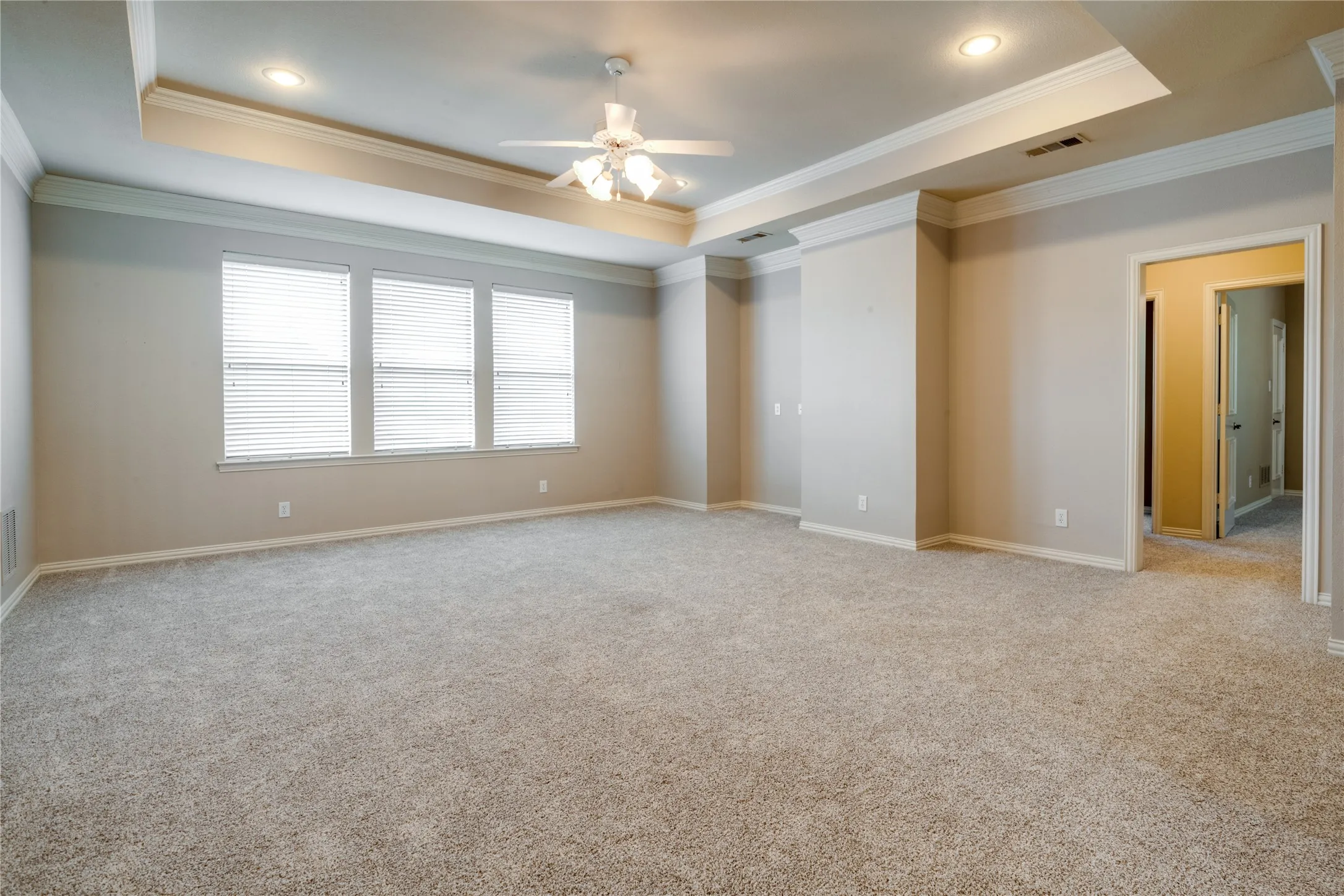 Upstairs Family room featuring a Tray ceiling with recessed lighting, ceiling fan, and carpet flooring