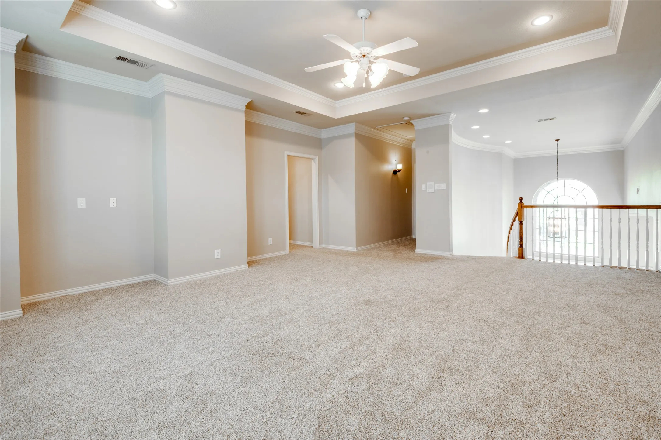 Upstairs Family room featuring a Tray ceiling with recessed lighting, ceiling fan, and carpet flooring