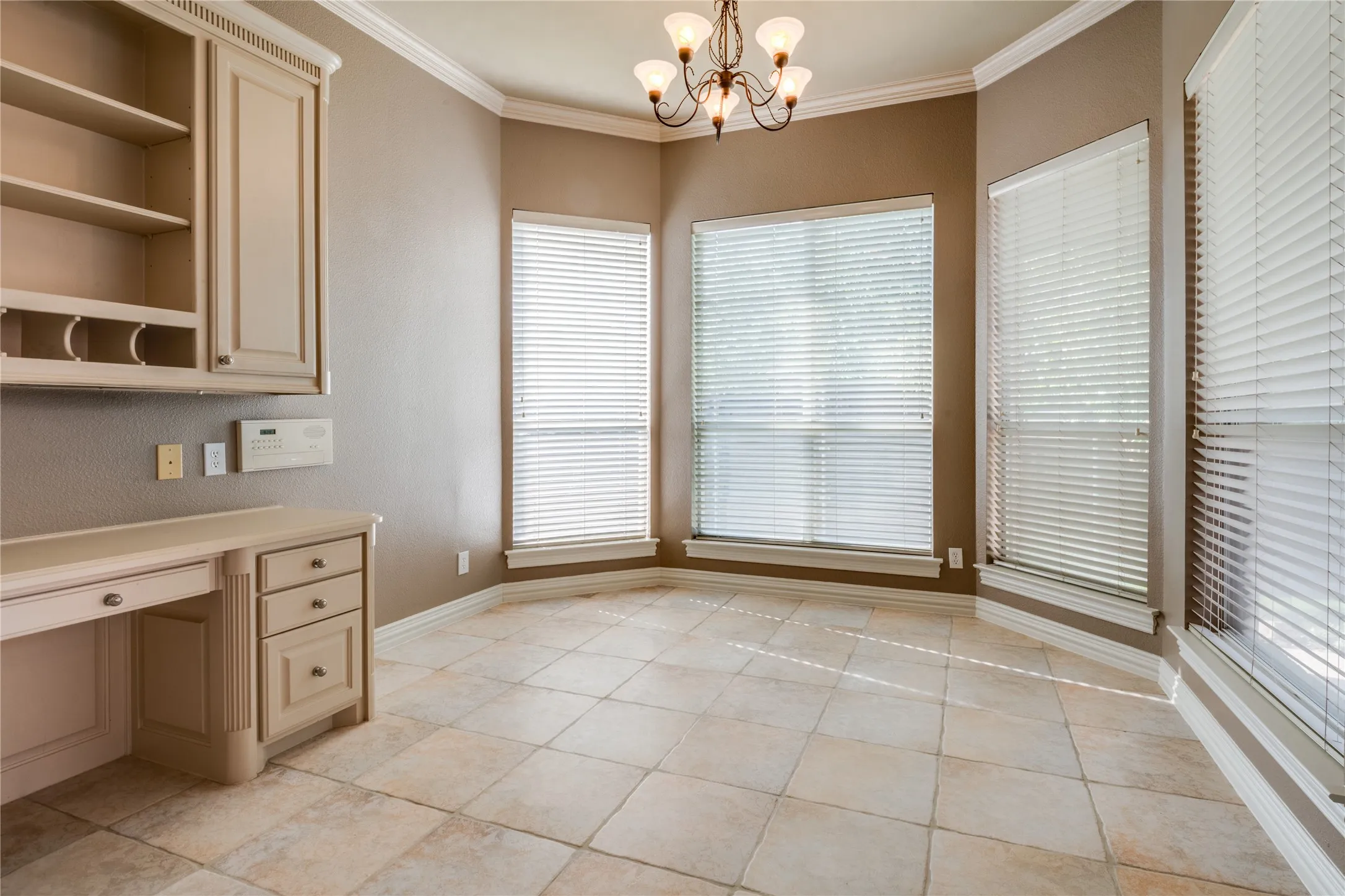 Breakfast Area featuring light-toned cabinetry, tile flooring, and large windows