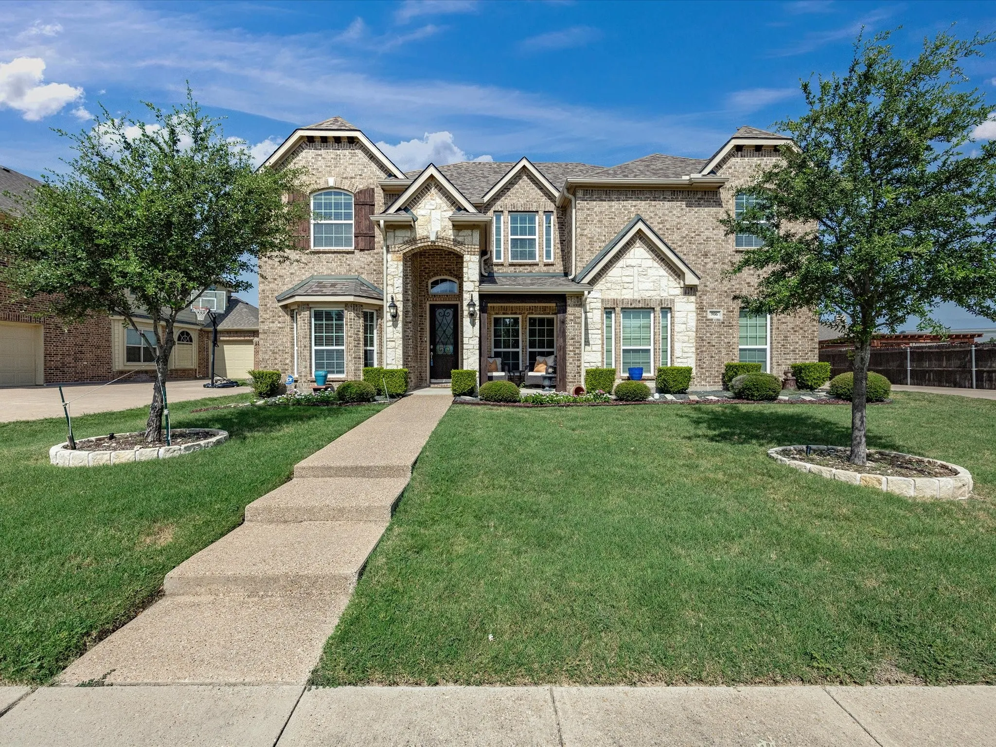 Brick and stone exterior with decorative window shutters
